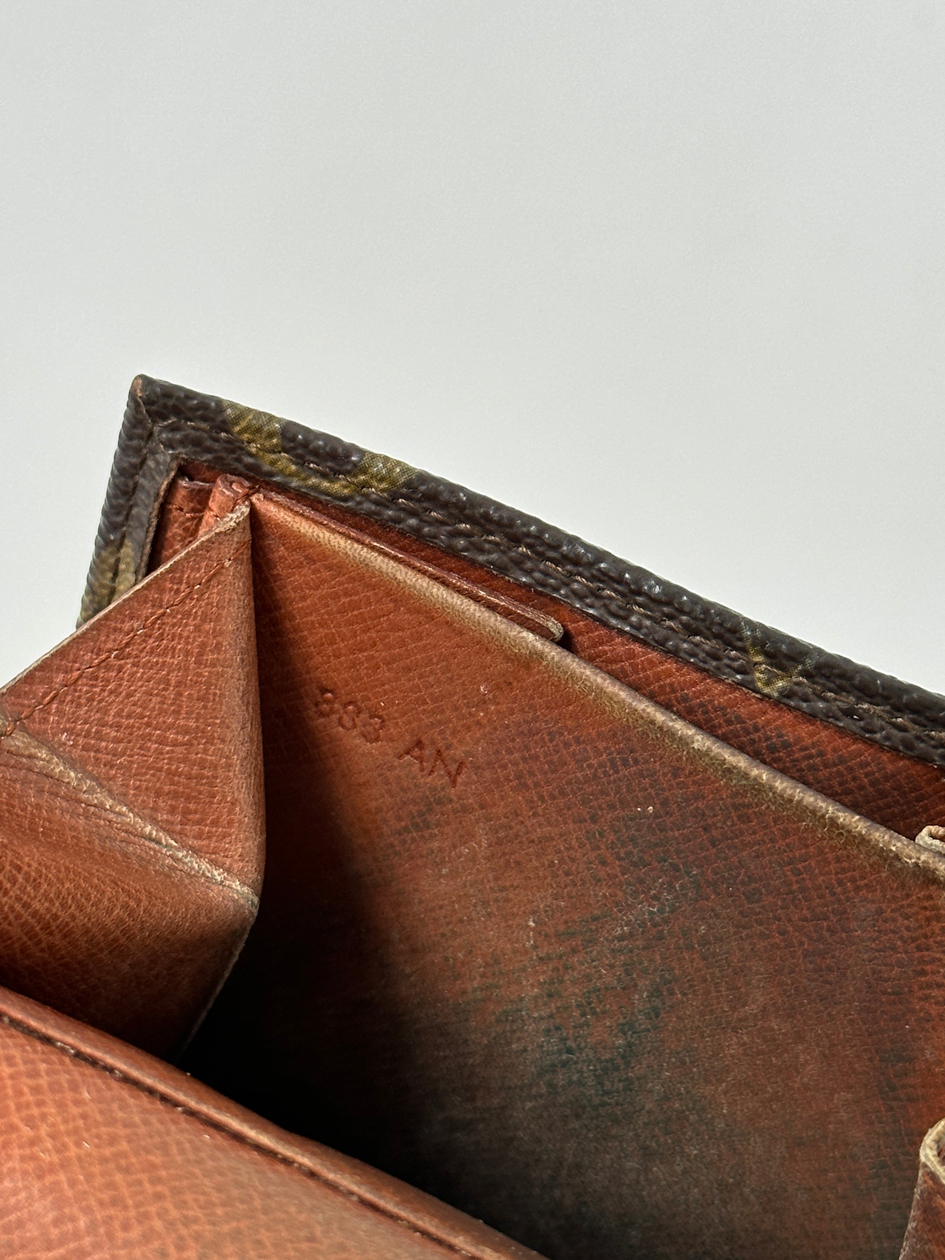 Louis Vuitton 1988 Monogram Wallet showing gold-tone hardware, monogram canvas, and multiple card slots.