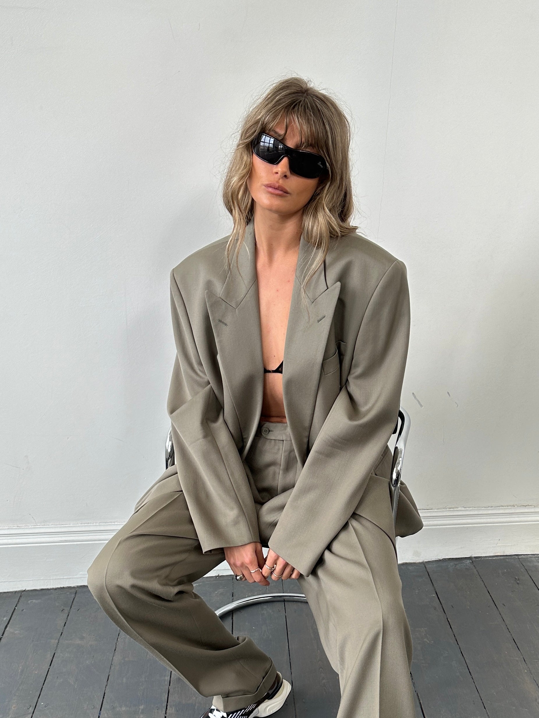 Prada 2000s shield sunglasses with black frames and dark tinted lenses, stylish eyewear for sun protection.