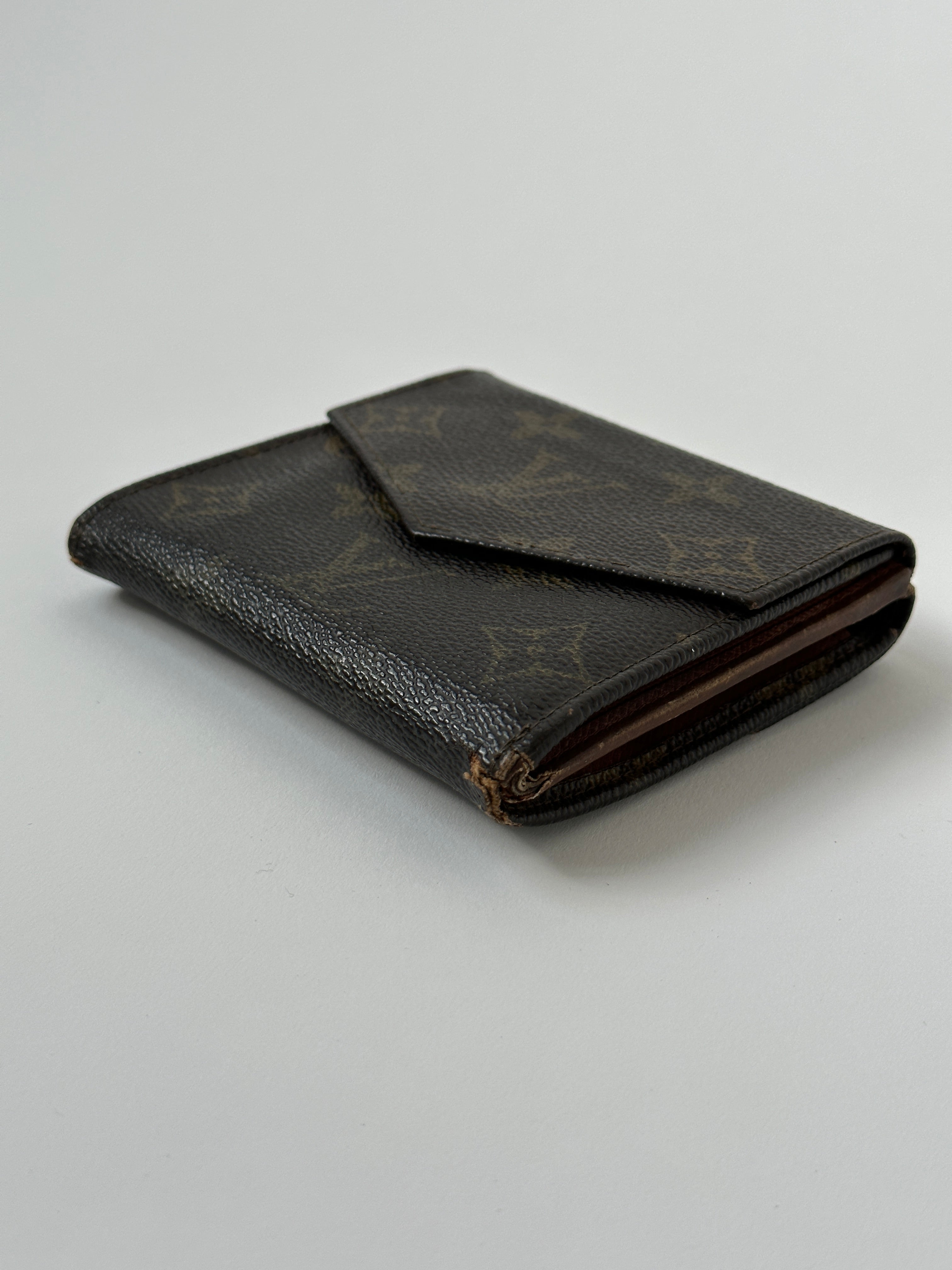 Louis Vuitton 1988 Monogram Wallet featuring classic monogram canvas, leather trim, and multiple card slots.
