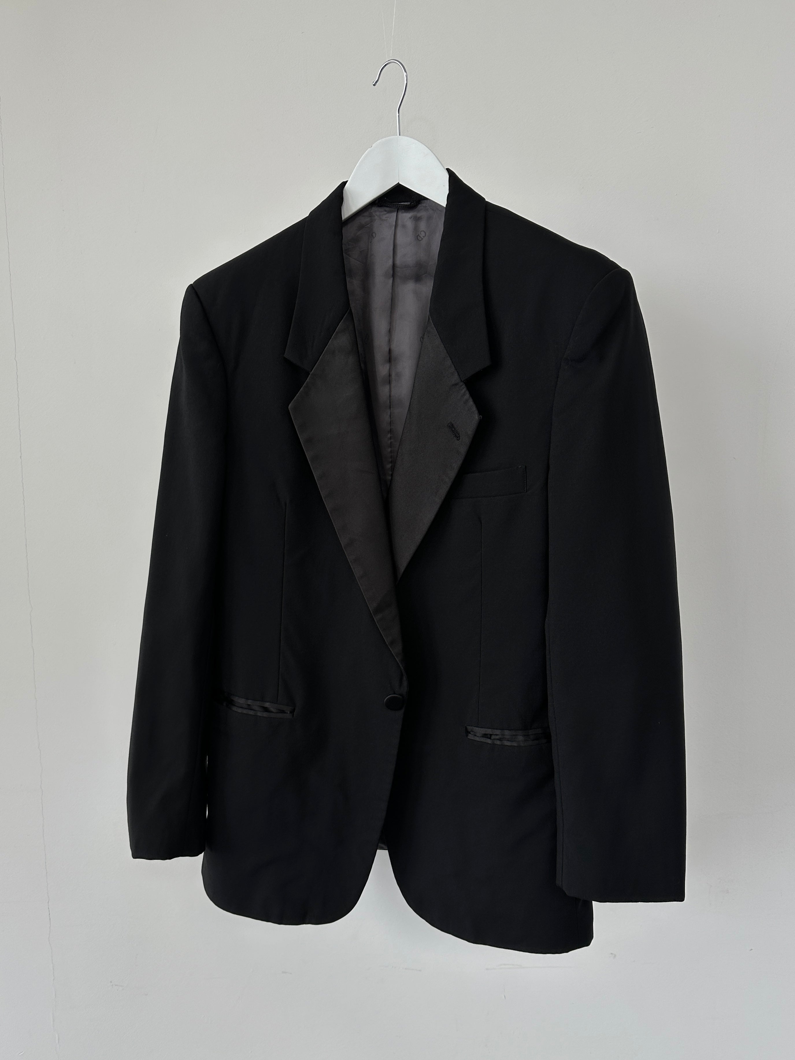 Christian Dior single-breasted wool blazer for men, tailored fit with notch lapels and button closure, in a classic dark color.