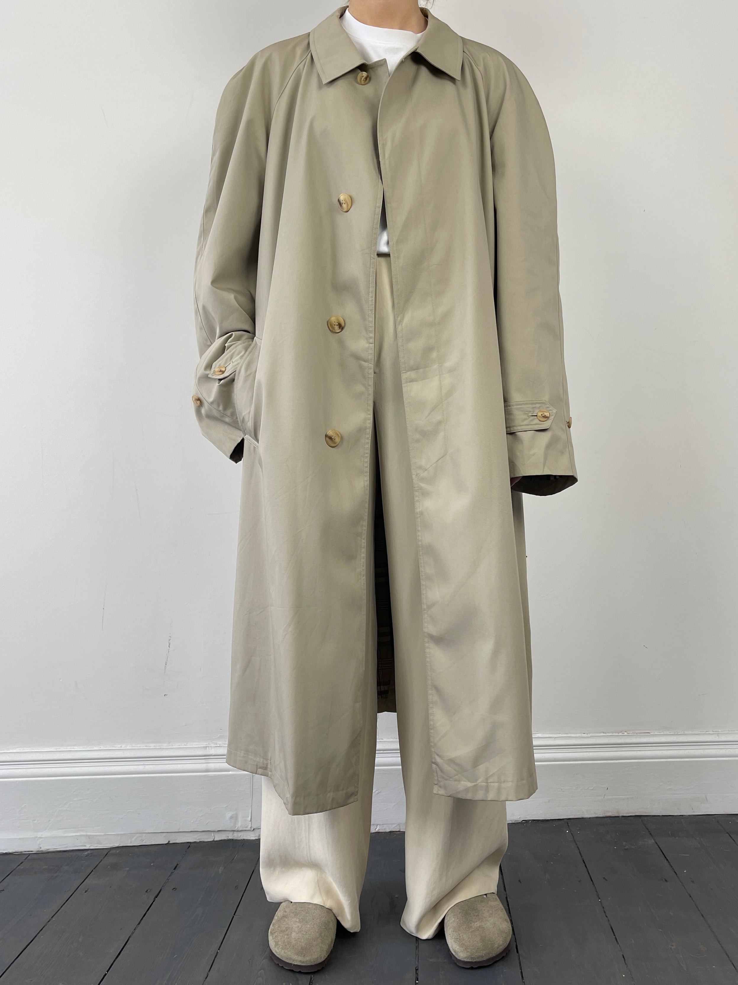 Vintage cotton belted trench coat featuring classic design, double-breasted front, and tailored fit in a timeless style.