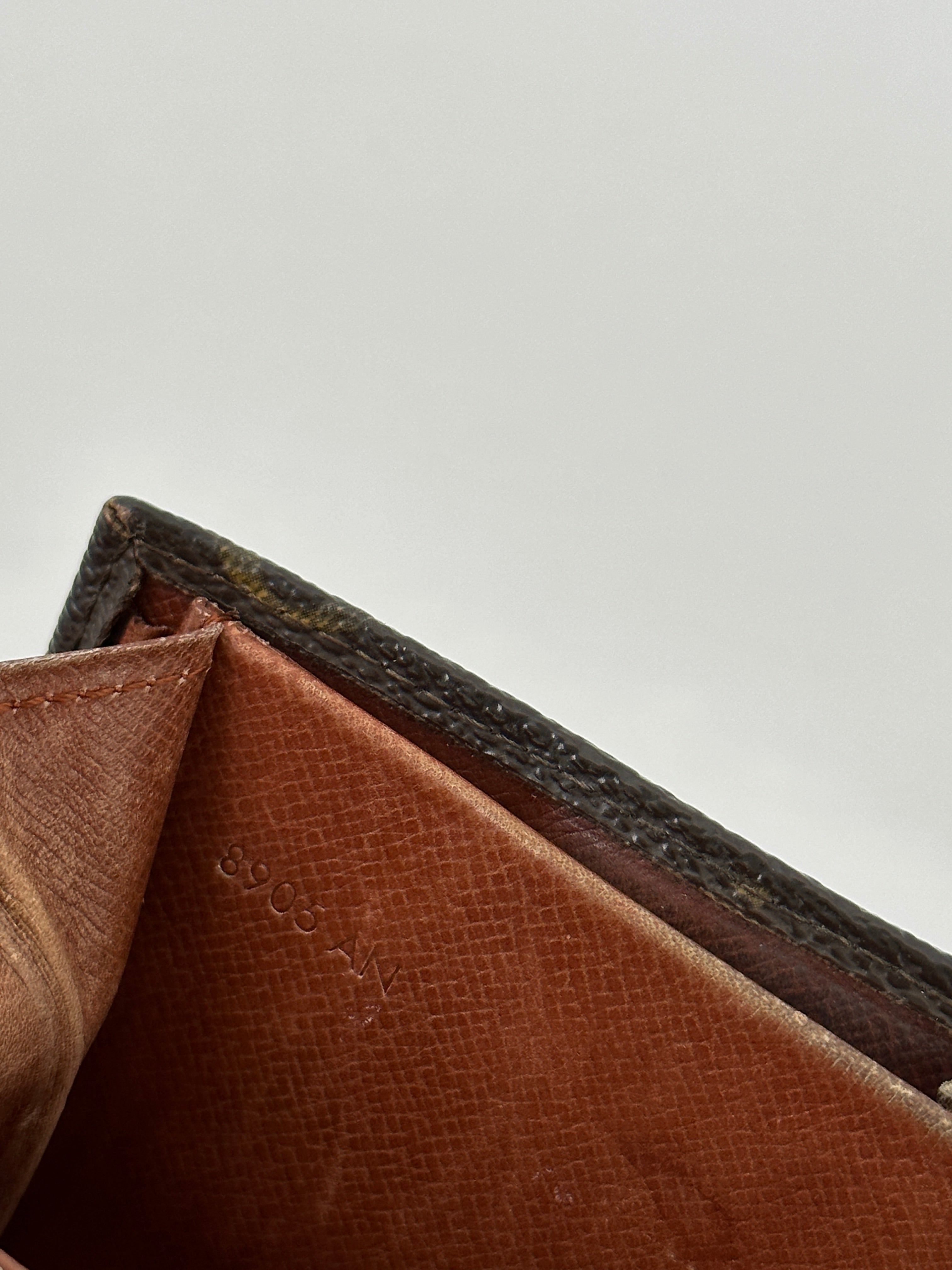 Louis Vuitton 1989 Monogram Wallet showing classic monogram canvas, gold-tone hardware, and multiple card slots.