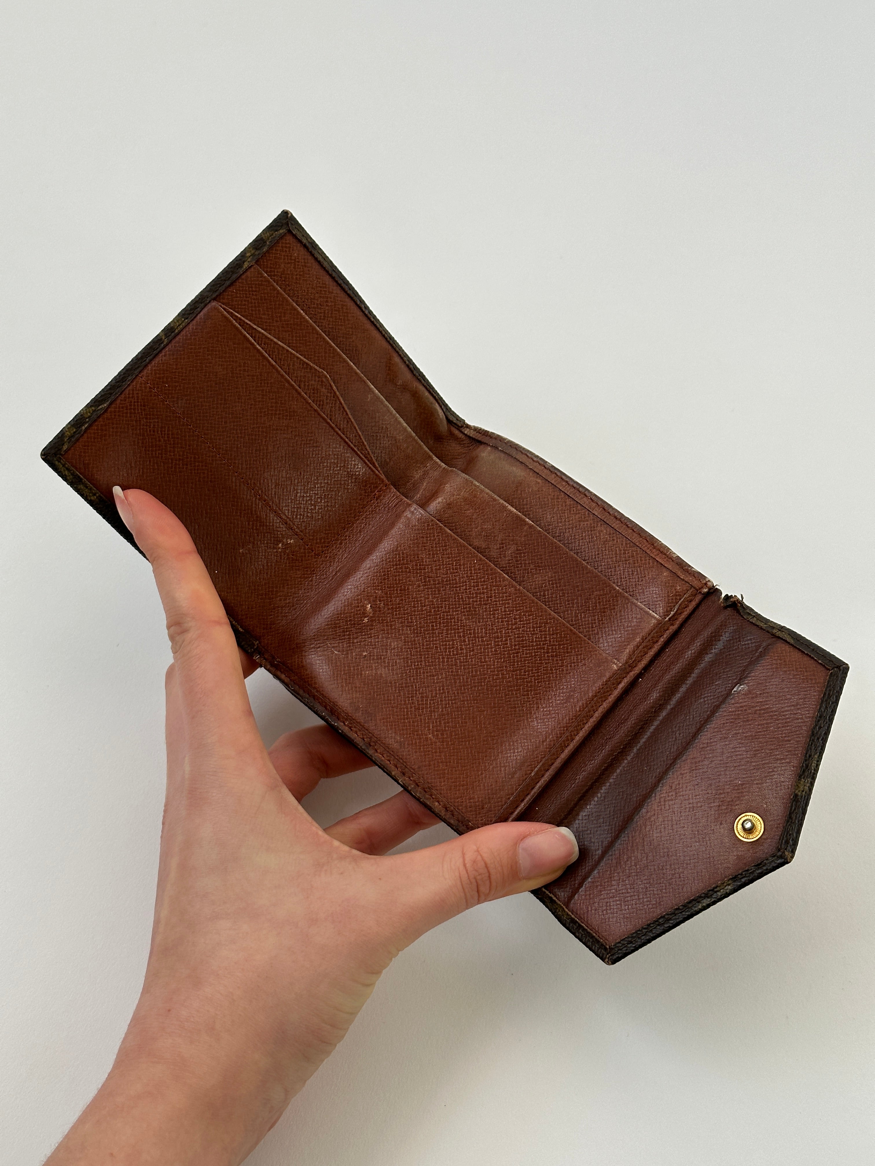 Louis Vuitton 1989 Monogram Wallet showing classic monogram canvas, zipper closure, and compact design.