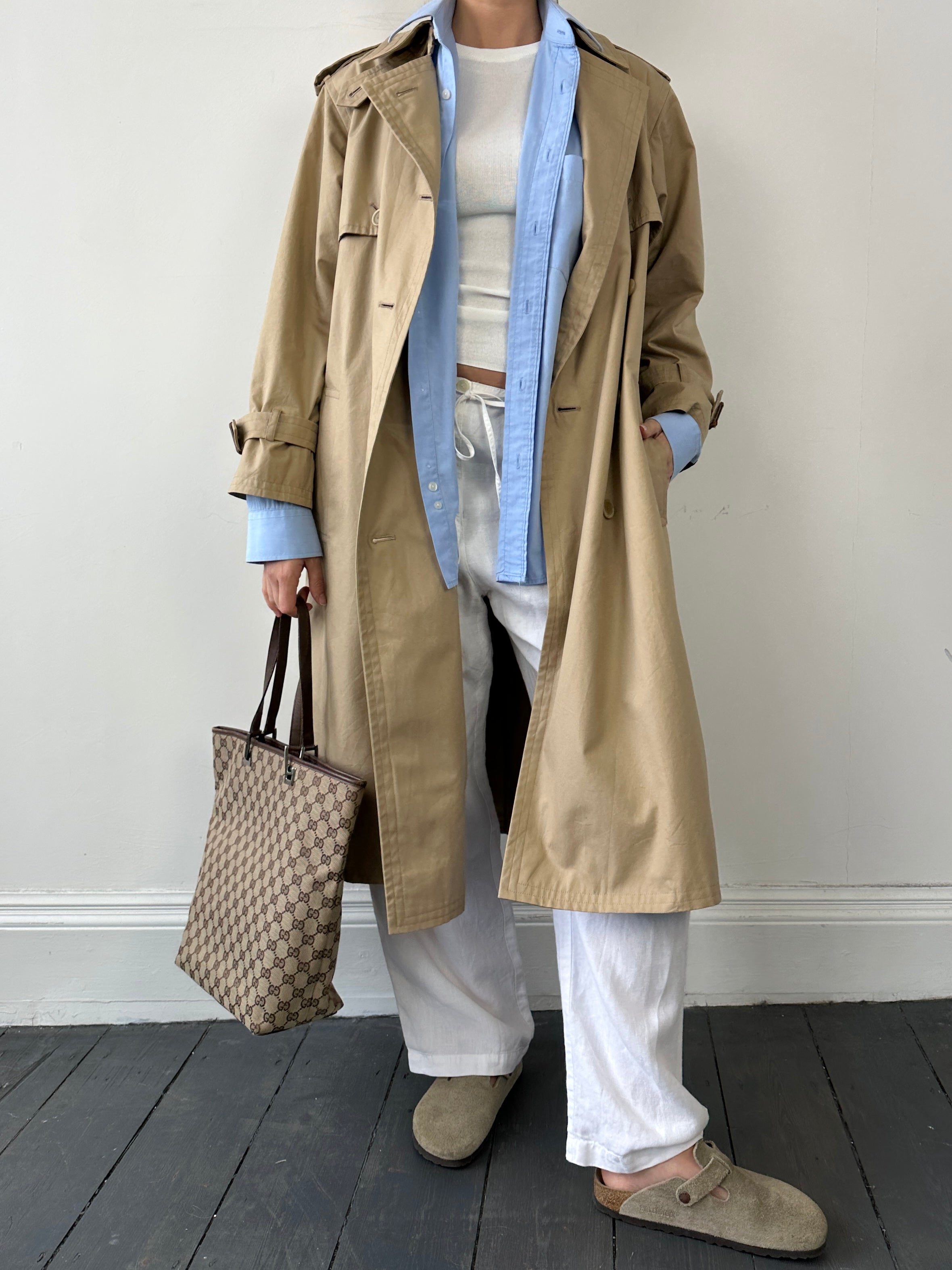 Yves Saint Laurent Paris double-breasted trench coat in size M, shown with classic collar and button details, stylish and elegant.