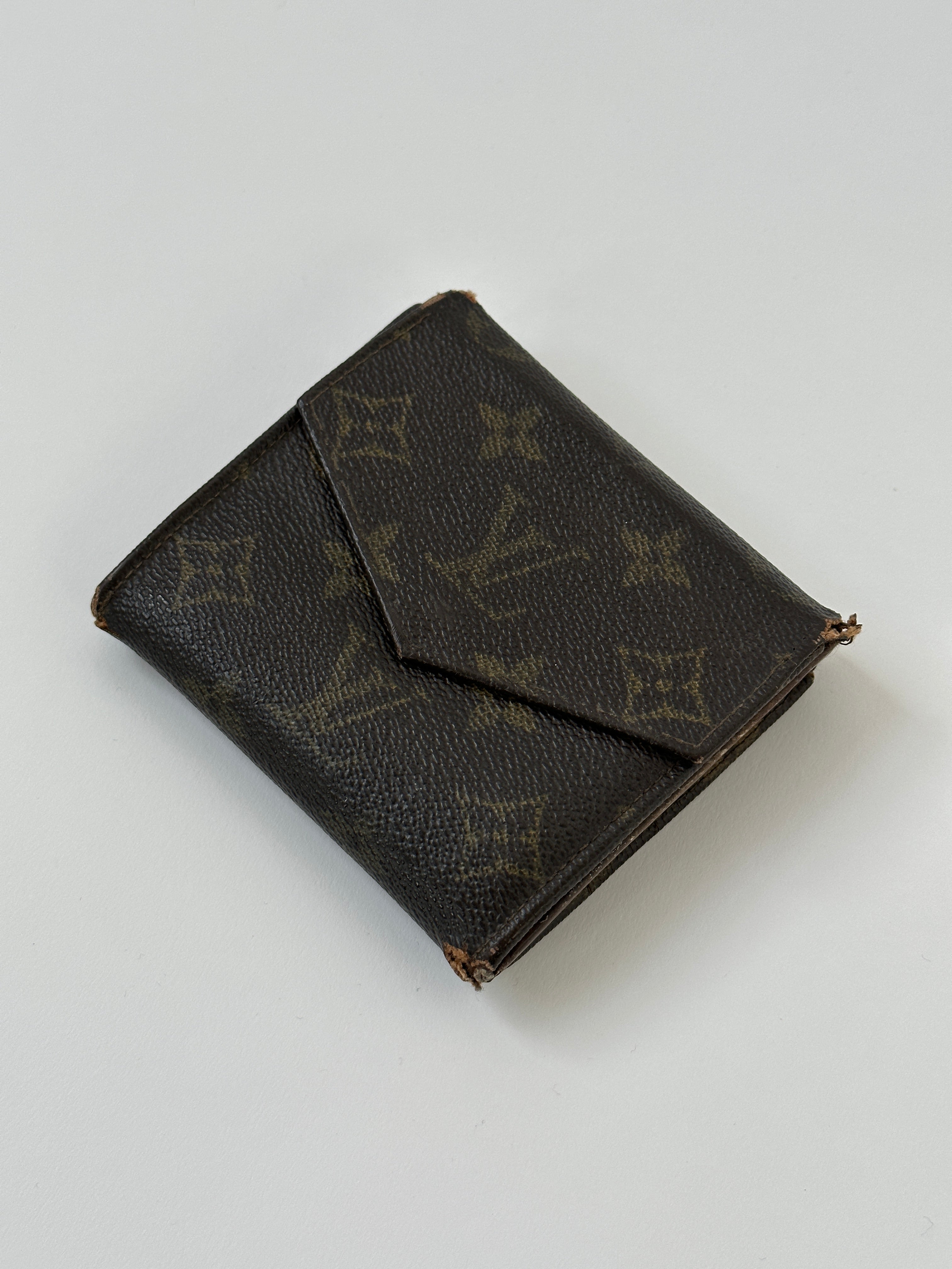 Louis Vuitton 1989 Monogram Wallet with classic LV monogram canvas, leather trim, and multiple card slots.