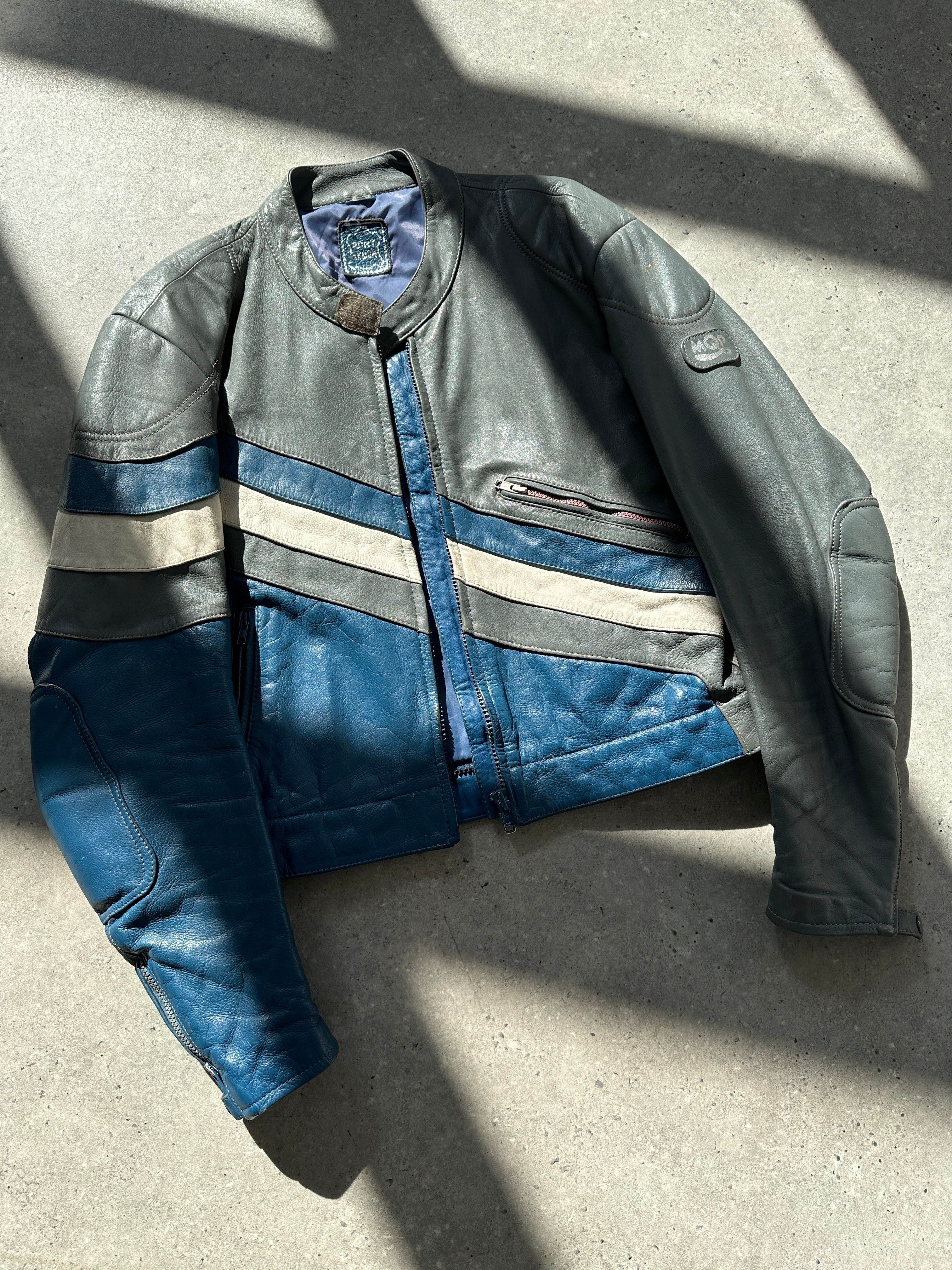 Vintage leather striped motorcycle jacket in M/L size, featuring classic design and detailed stitching on durable leather material.