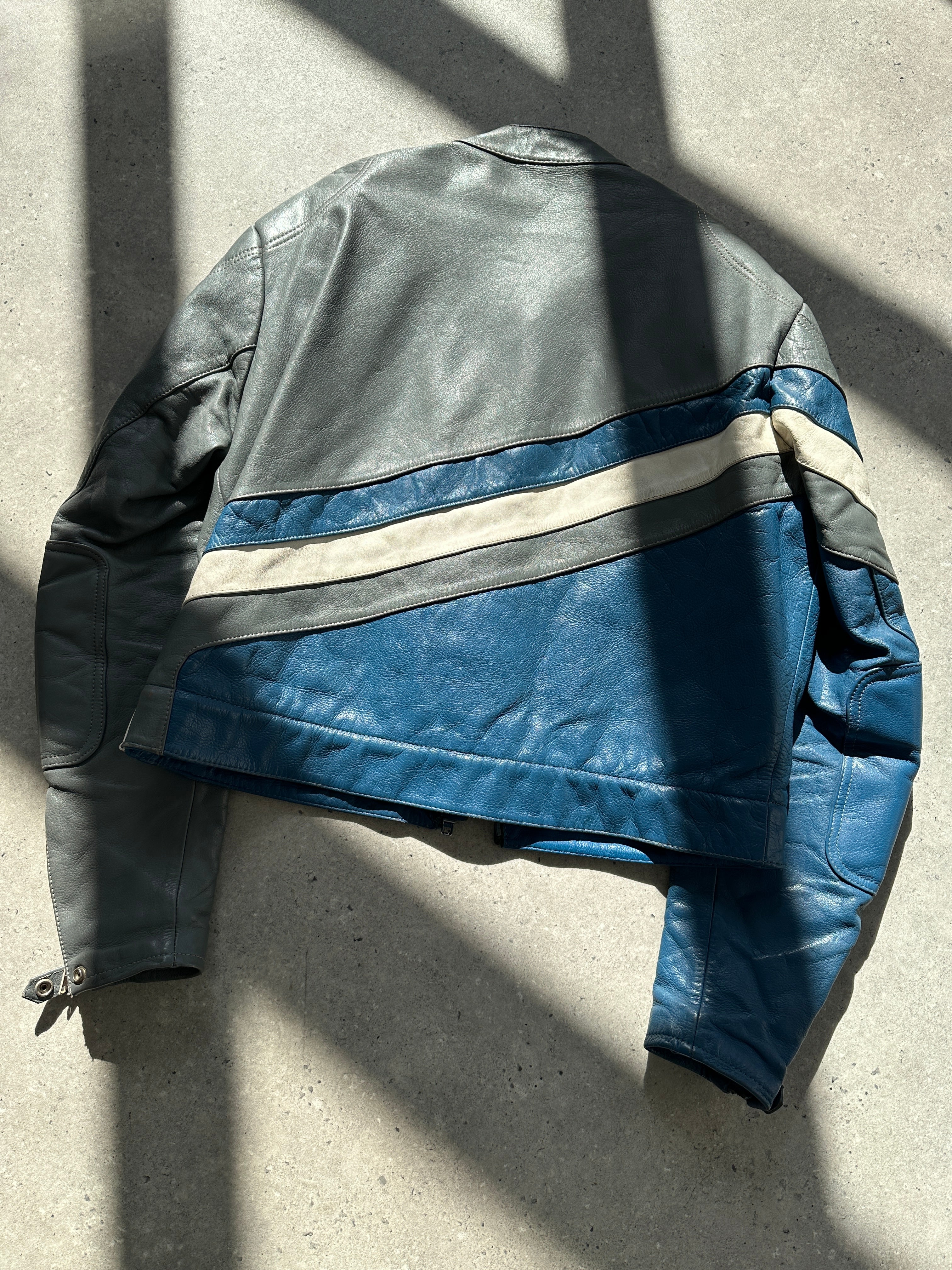 Vintage leather striped motorcycle jacket in size M/L, featuring classic design and rugged style for motorcycle enthusiasts.