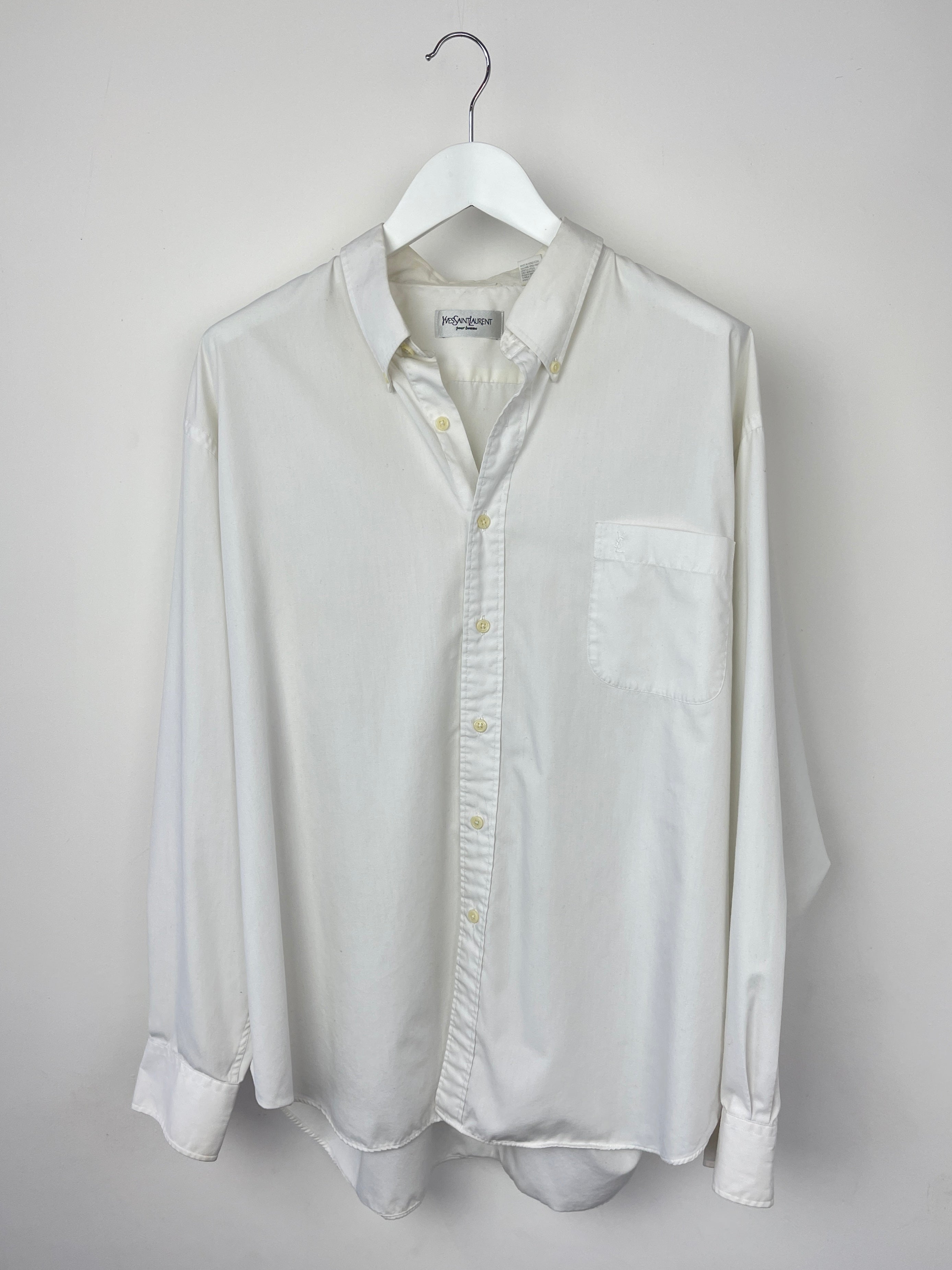 Yves Saint Laurent cotton shirt, stylish men's or women's button-up top in soft, breathable fabric, displayed on a hanger.