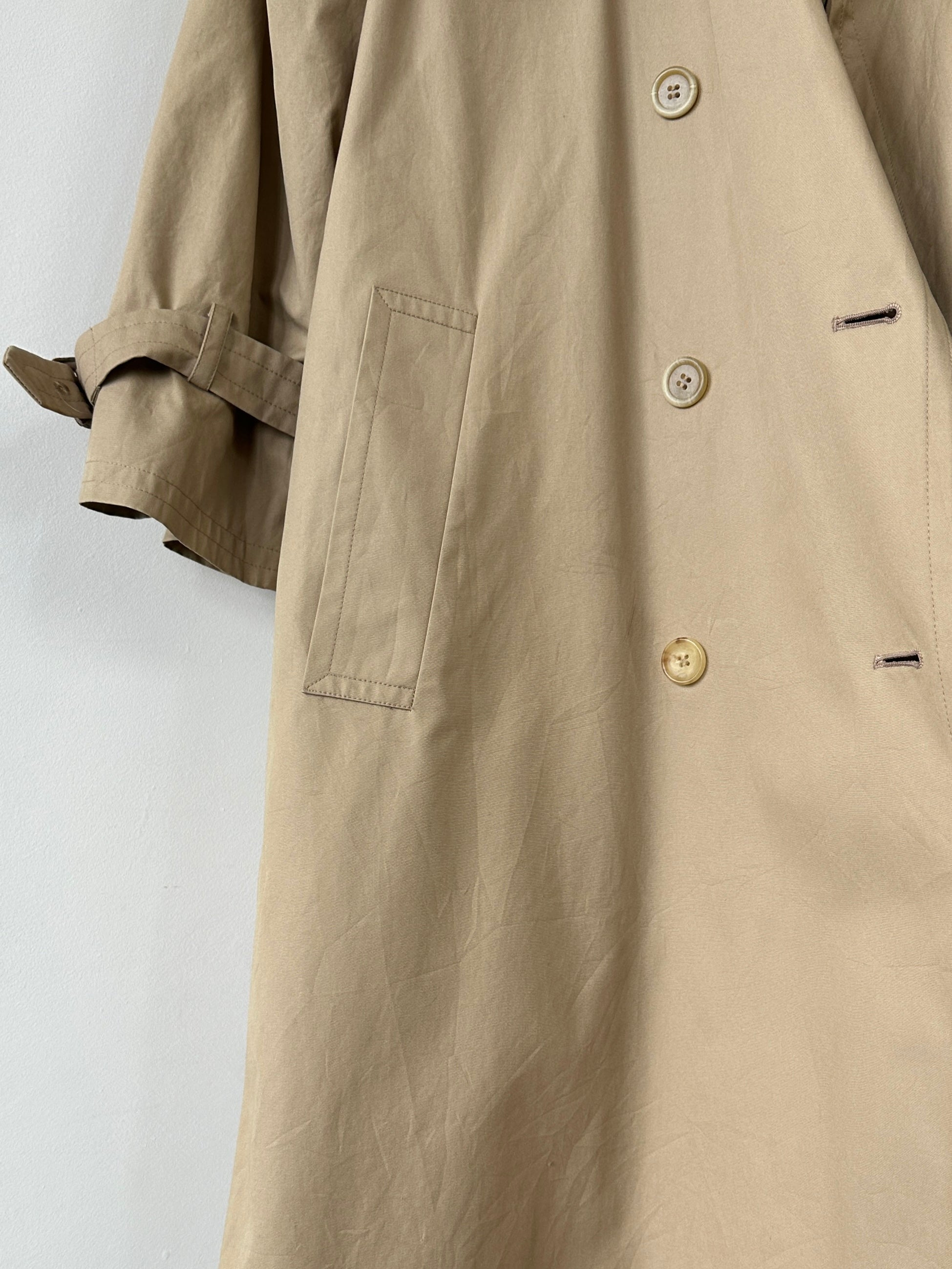Yves Saint Laurent Paris double-breasted trench coat in black, tailored fit with classic collar and belt, size M.