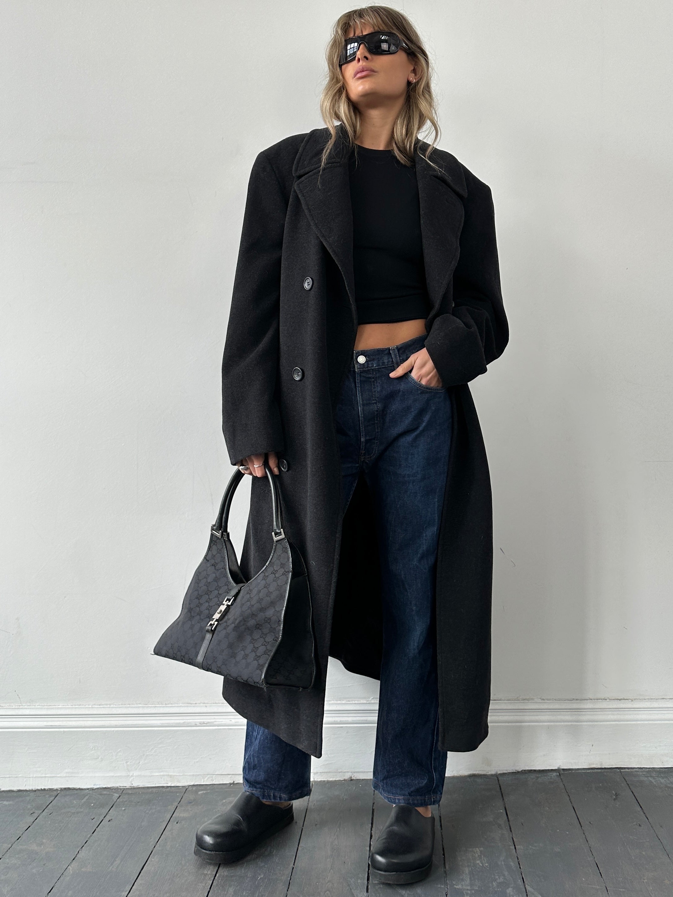 Hugo Boss belted virgin wool coat in size XL, featuring a classic tailored design with a belt, lapel collar, and front pockets.
