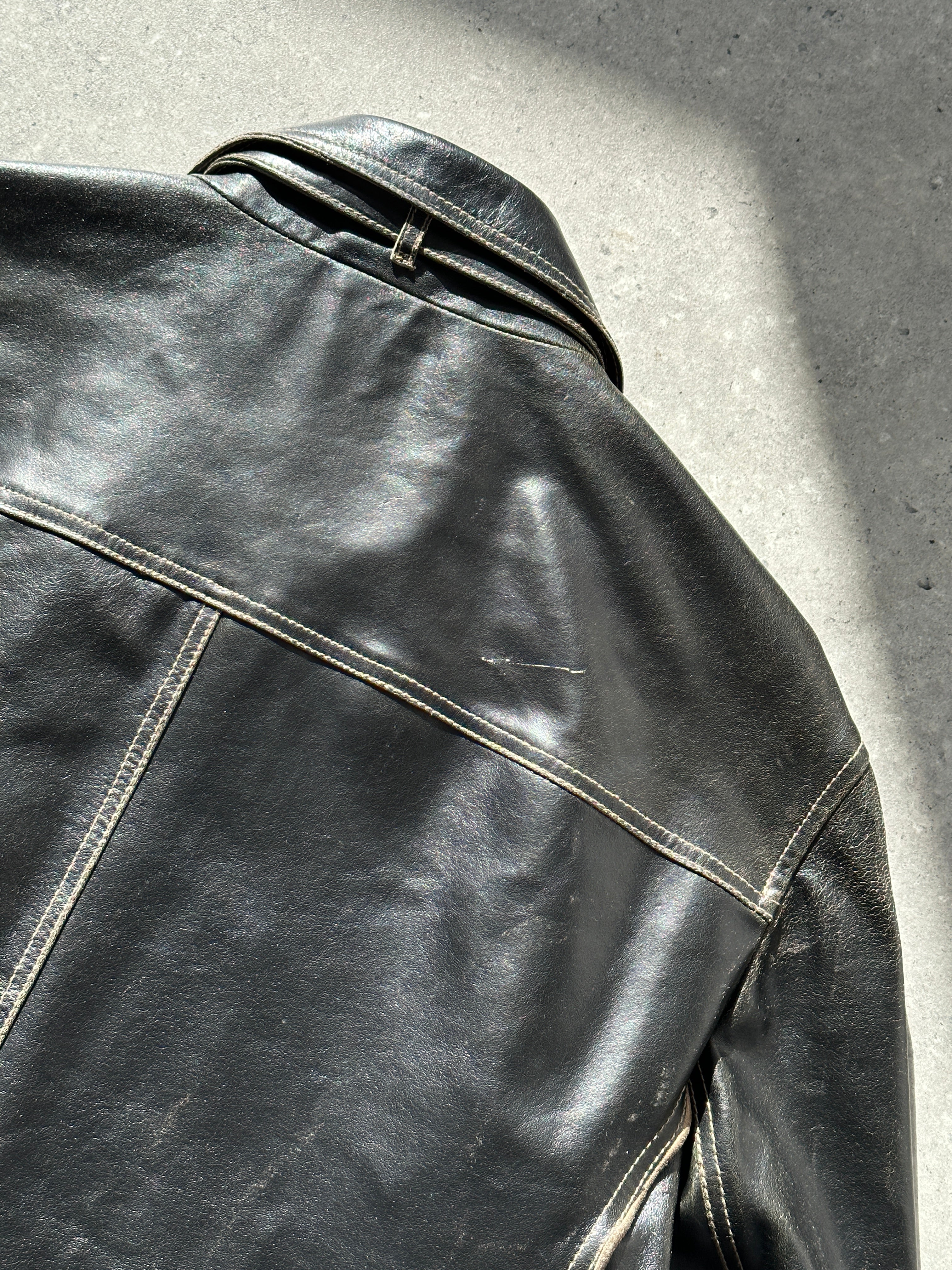 Armani Jeans black leather jacket with contrast stitching and classic collar, front view showing zipper closure and stylish design.