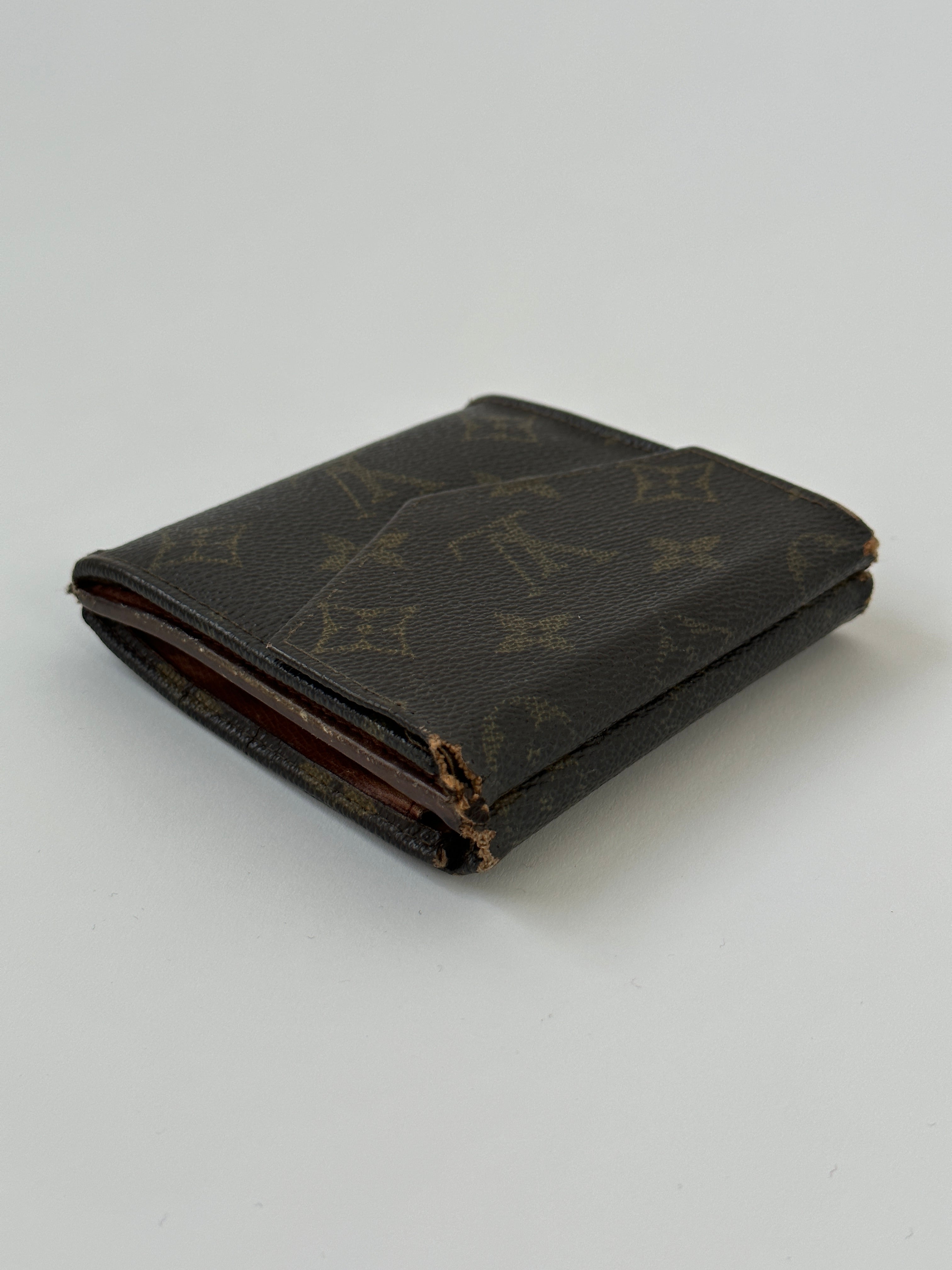Louis Vuitton 1989 Monogram Wallet with classic LV monogram pattern and leather trim, front view showing wallet details.
