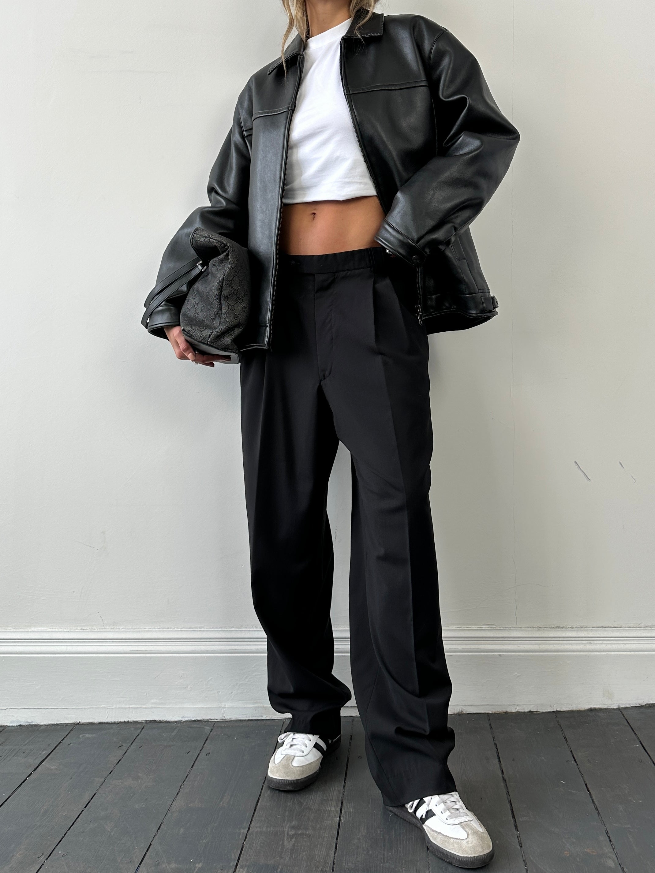 Vintage double zip faux leather jacket in size M/L, featuring a classic design with two front zippers and stylish detailing.
