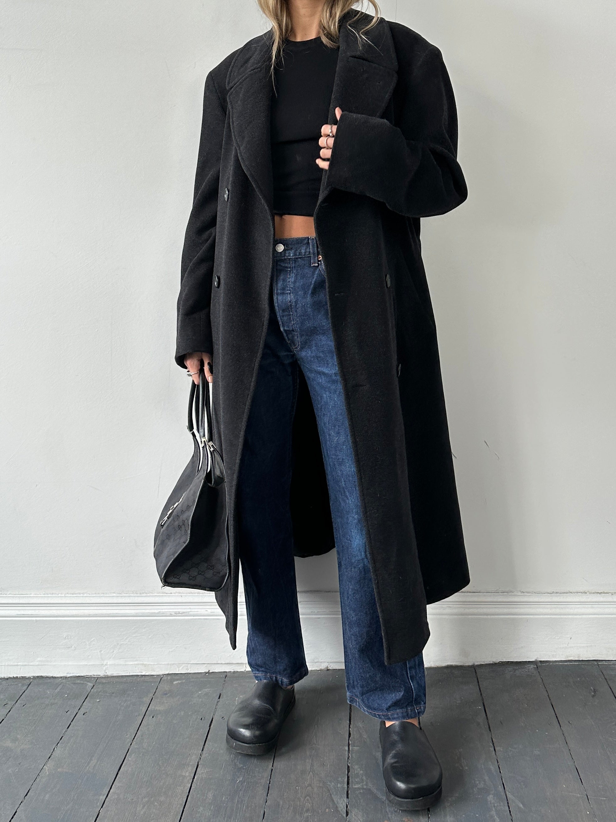 Hugo Boss belted virgin wool coat in XL, featuring classic design and tailored fit, displayed on a hanger.