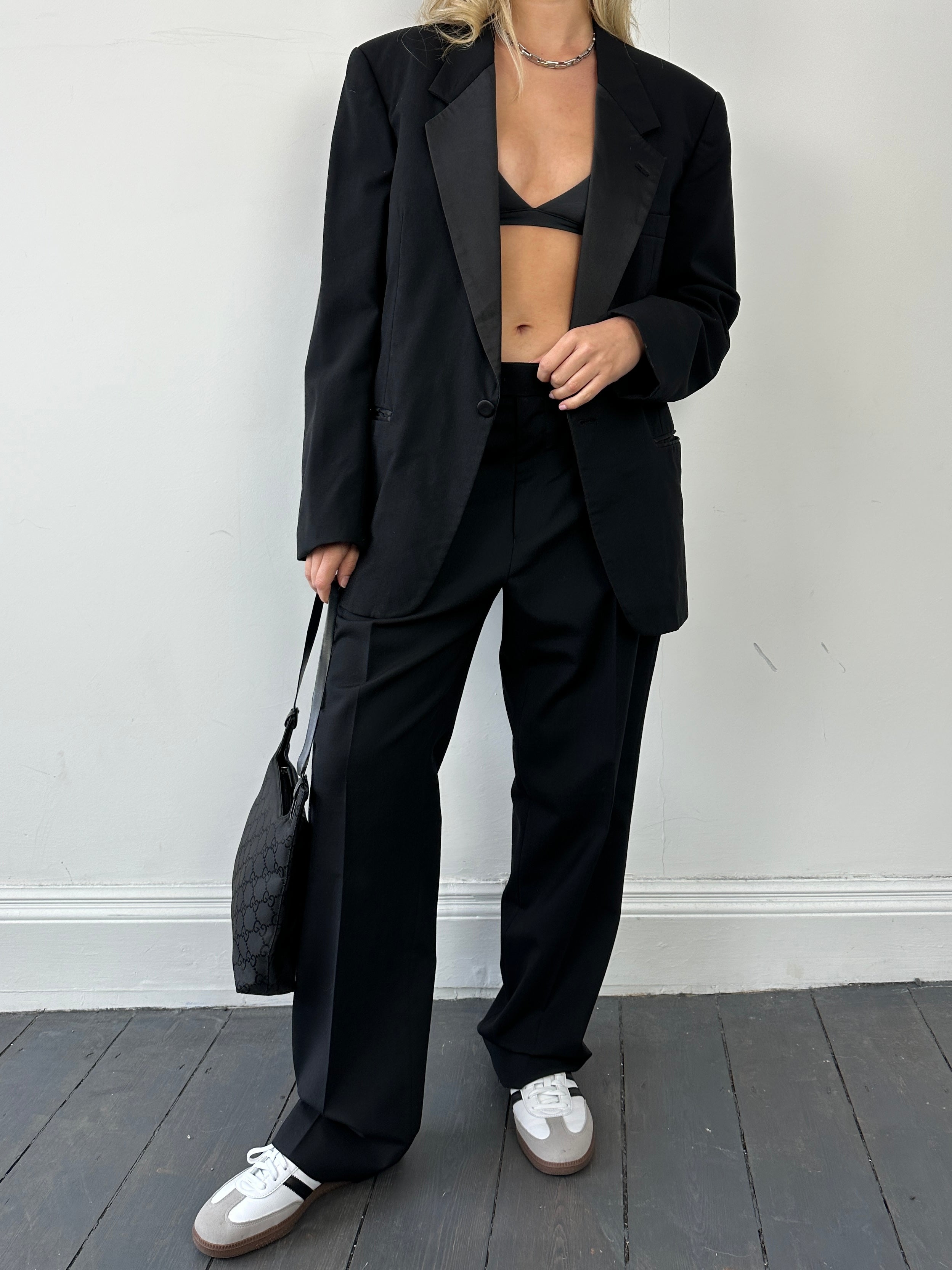Christian Dior tuxedo single-breasted wool blazer in black, tailored fit with peak lapels and button closure.