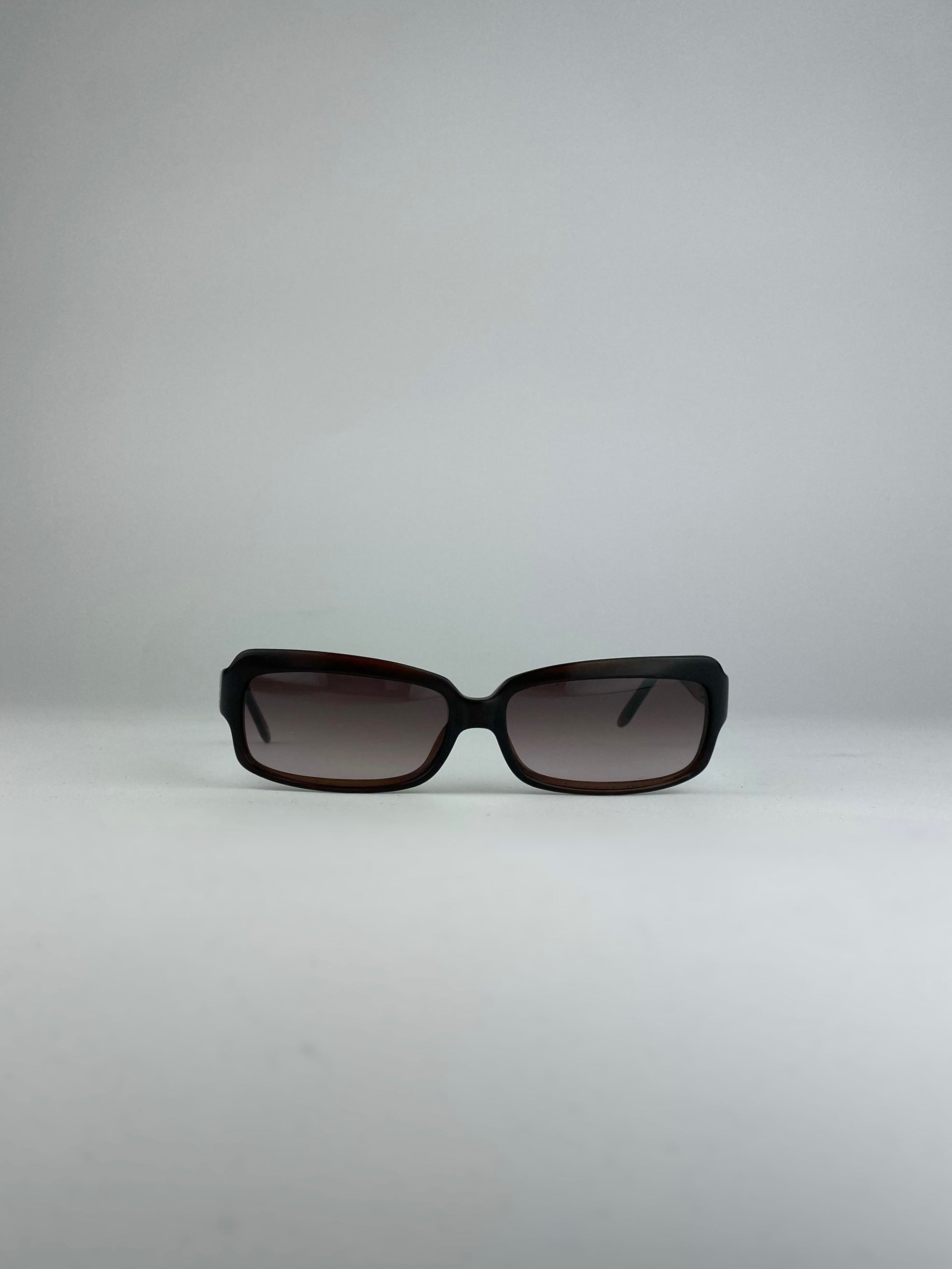 Loewe rectangle sunglasses with brown frames and dark lenses, stylish eyewear for sun protection and fashion.