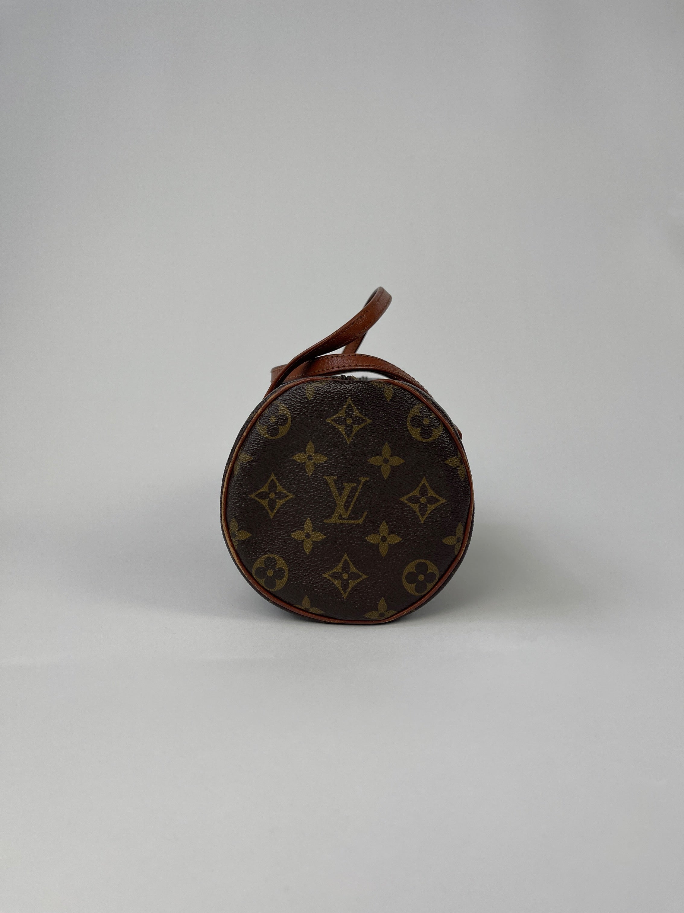 Louis Vuitton 1986 Papillon 26 Monogram Hand Bag with brown leather accents and signature LV monogram pattern.