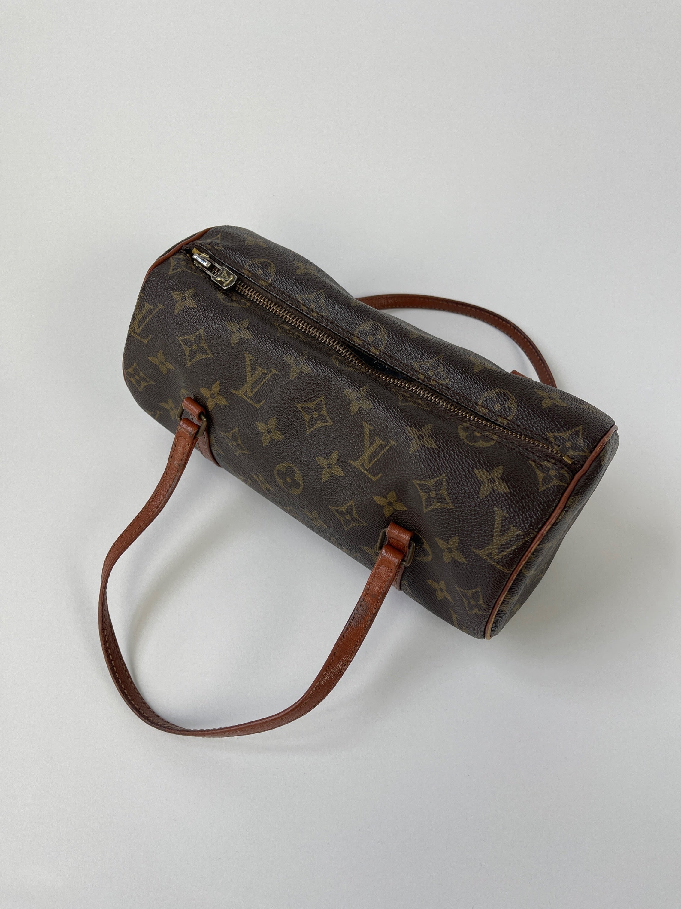 Louis Vuitton 1986 Papillon 26 Monogram hand bag with brown leather accents, featuring the signature LV monogram canvas and top handle.