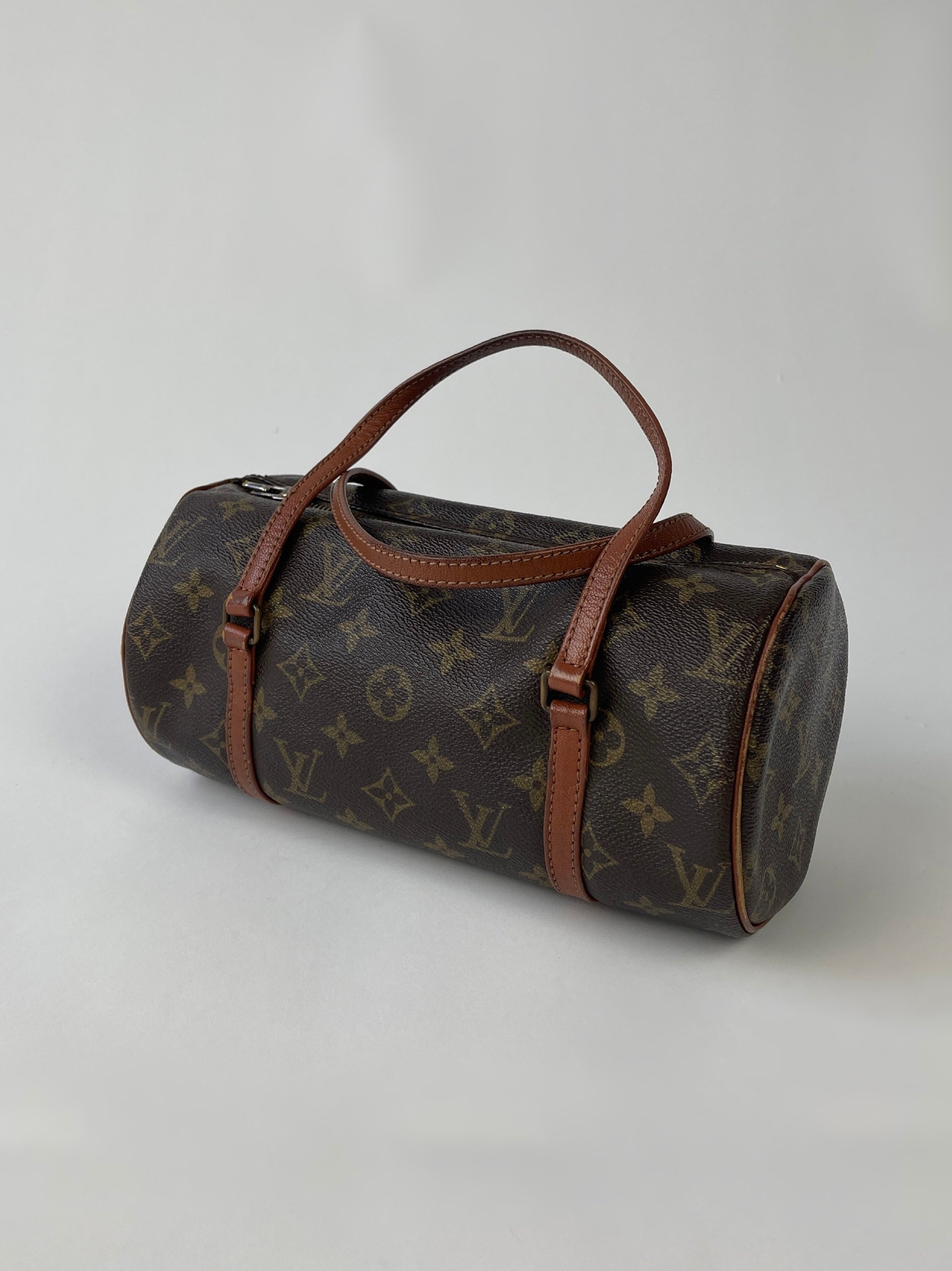 Louis Vuitton 1986 Papillon 26 Monogram Hand Bag in brown leather with signature LV monogram pattern and top handle.