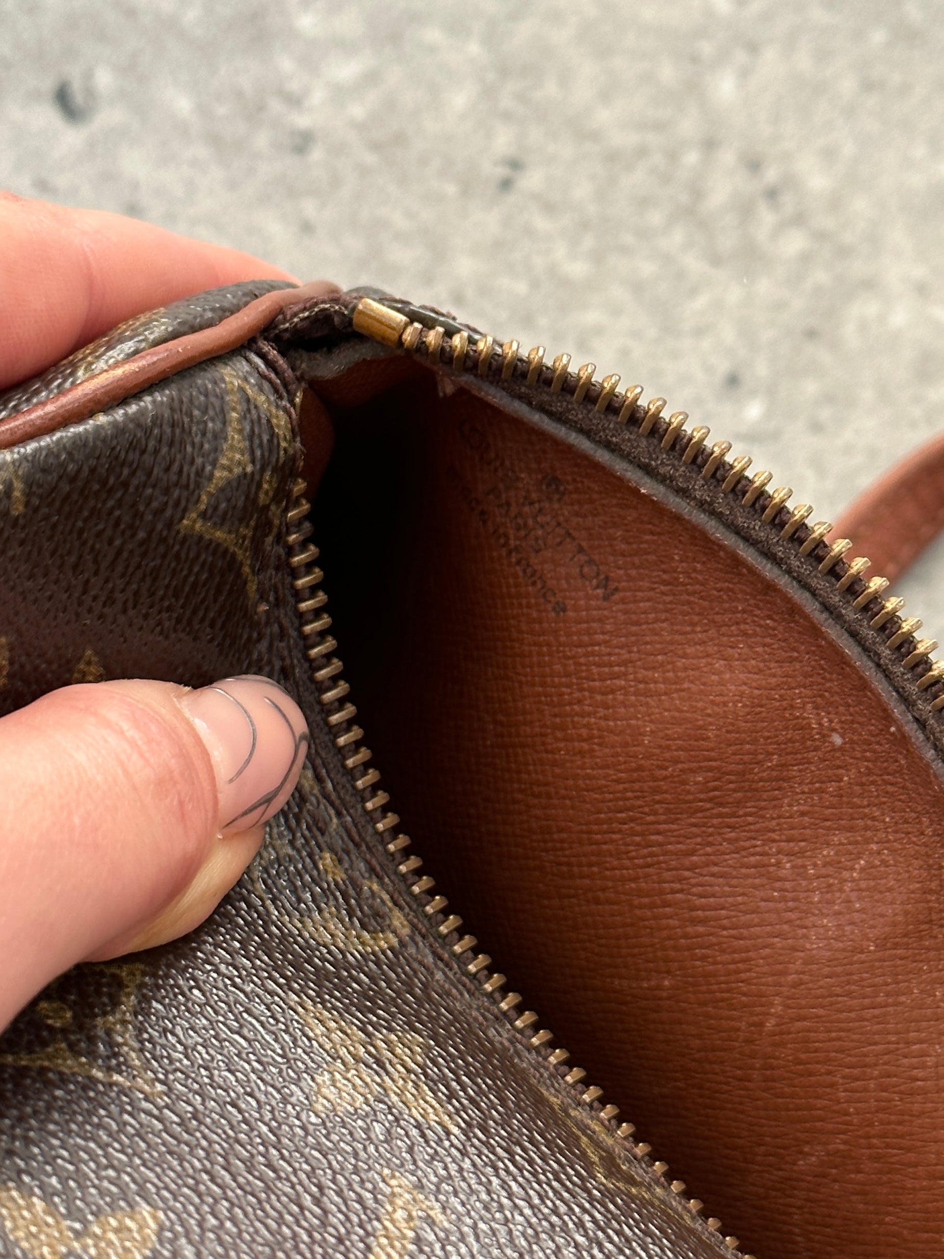 Louis Vuitton 1986 Papillon 26 Monogram Hand Bag with brown leather accents and signature LV monogram pattern.