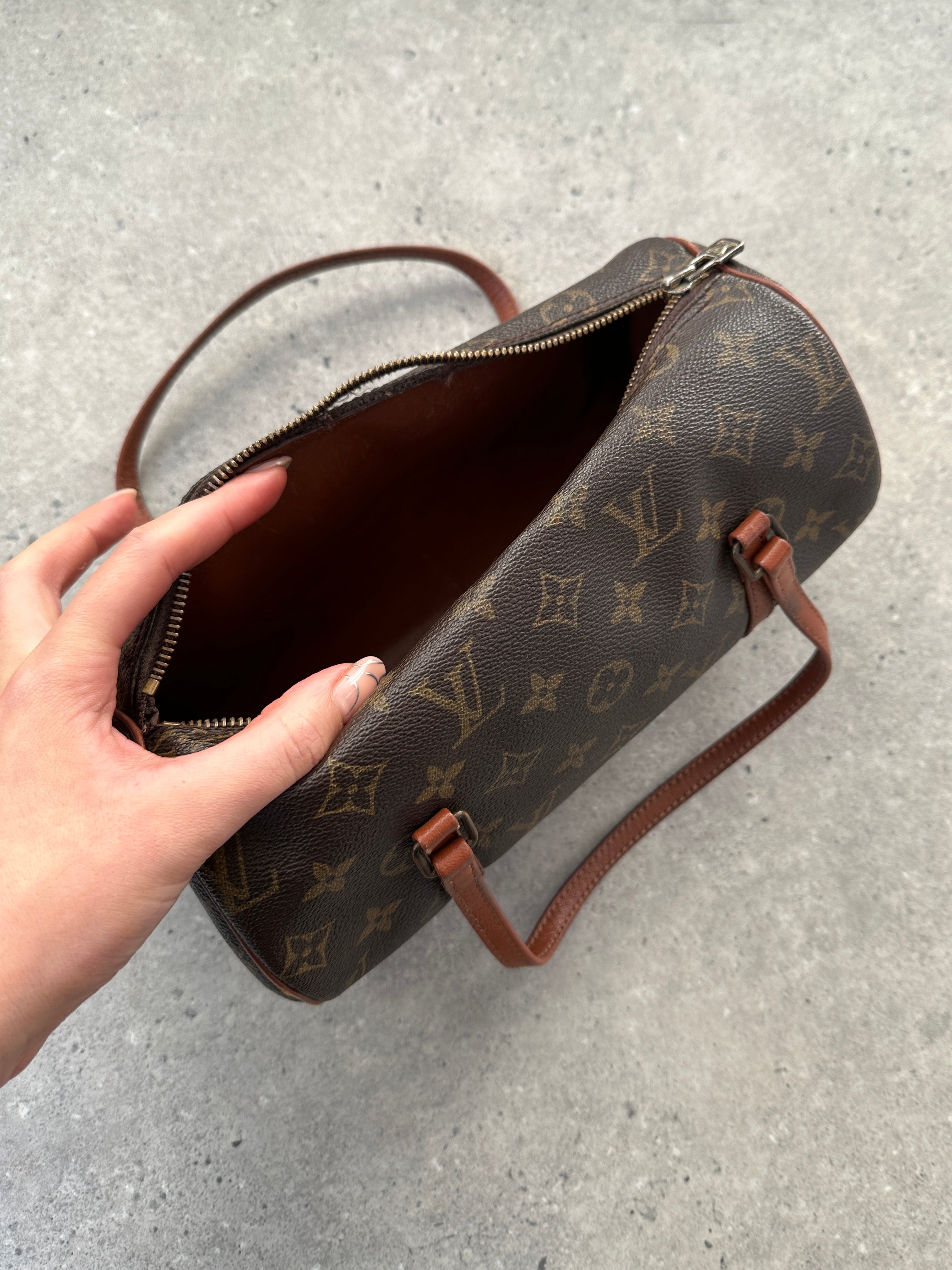 Louis Vuitton 1986 Papillon 26 Monogram handbag with brown leather accents and adjustable strap, stylish and iconic designer bag.