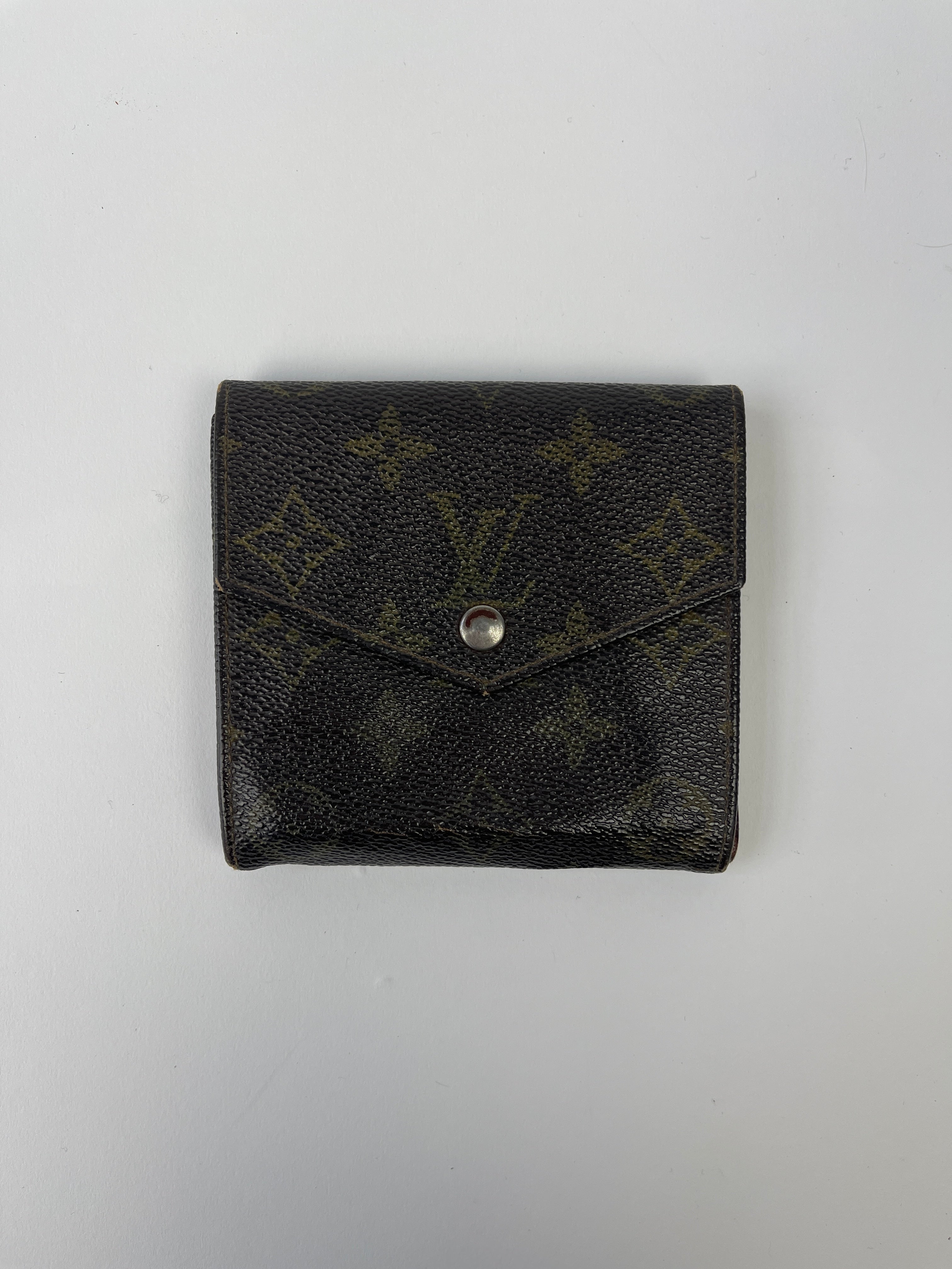 Louis Vuitton 1984 Monogram Wallet with brown leather and signature LV monogram pattern, compact and stylish for everyday use.