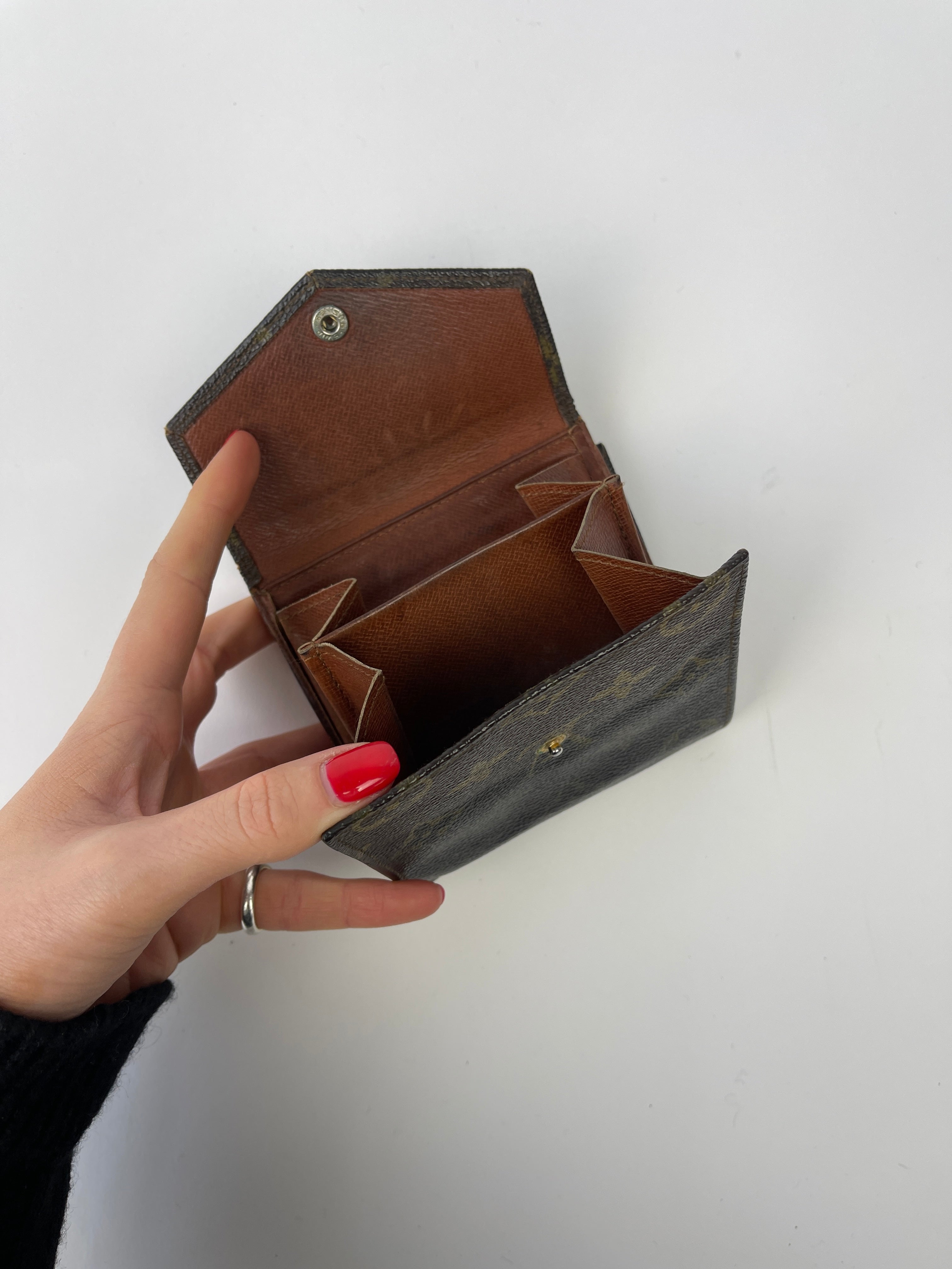 Louis Vuitton 1984 Monogram Wallet, brown leather wallet with Louis Vuitton monogram pattern, classic and stylish accessory.