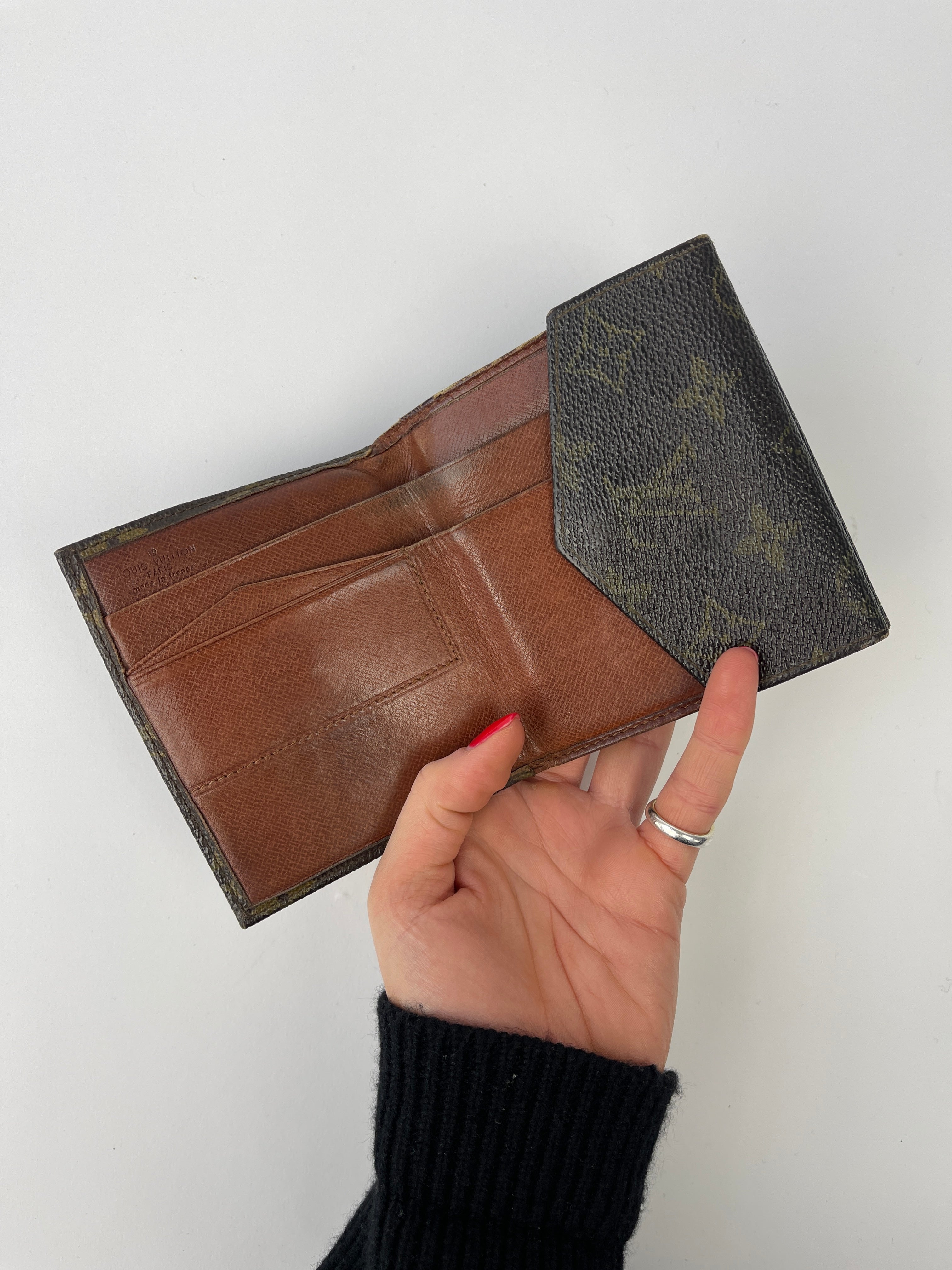 Louis Vuitton 1984 Monogram Wallet in brown leather with signature LV monogram pattern and multiple card slots.