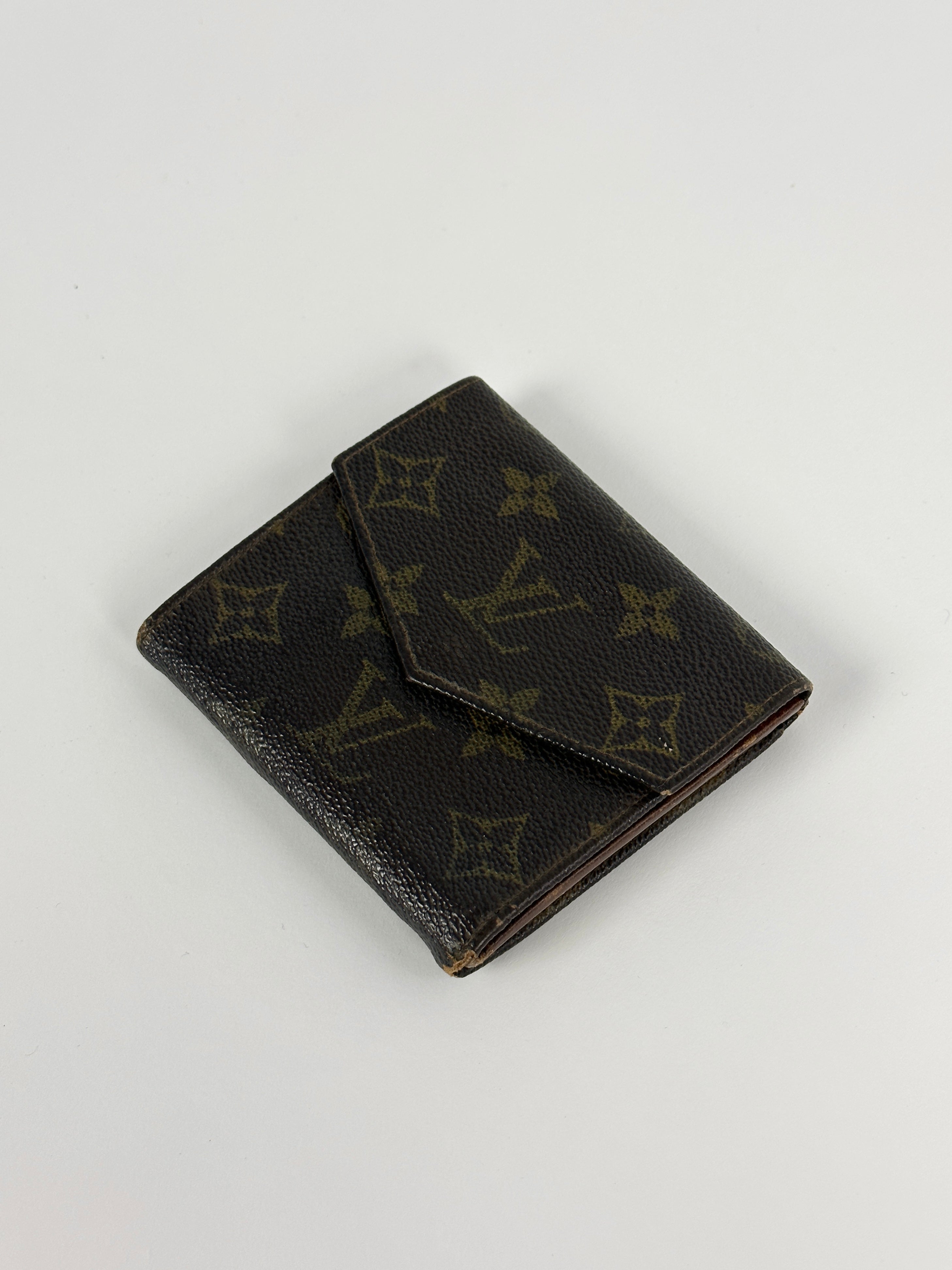 Louis Vuitton 1984 Monogram Wallet in brown leather with signature LV monogram pattern and multiple card slots.