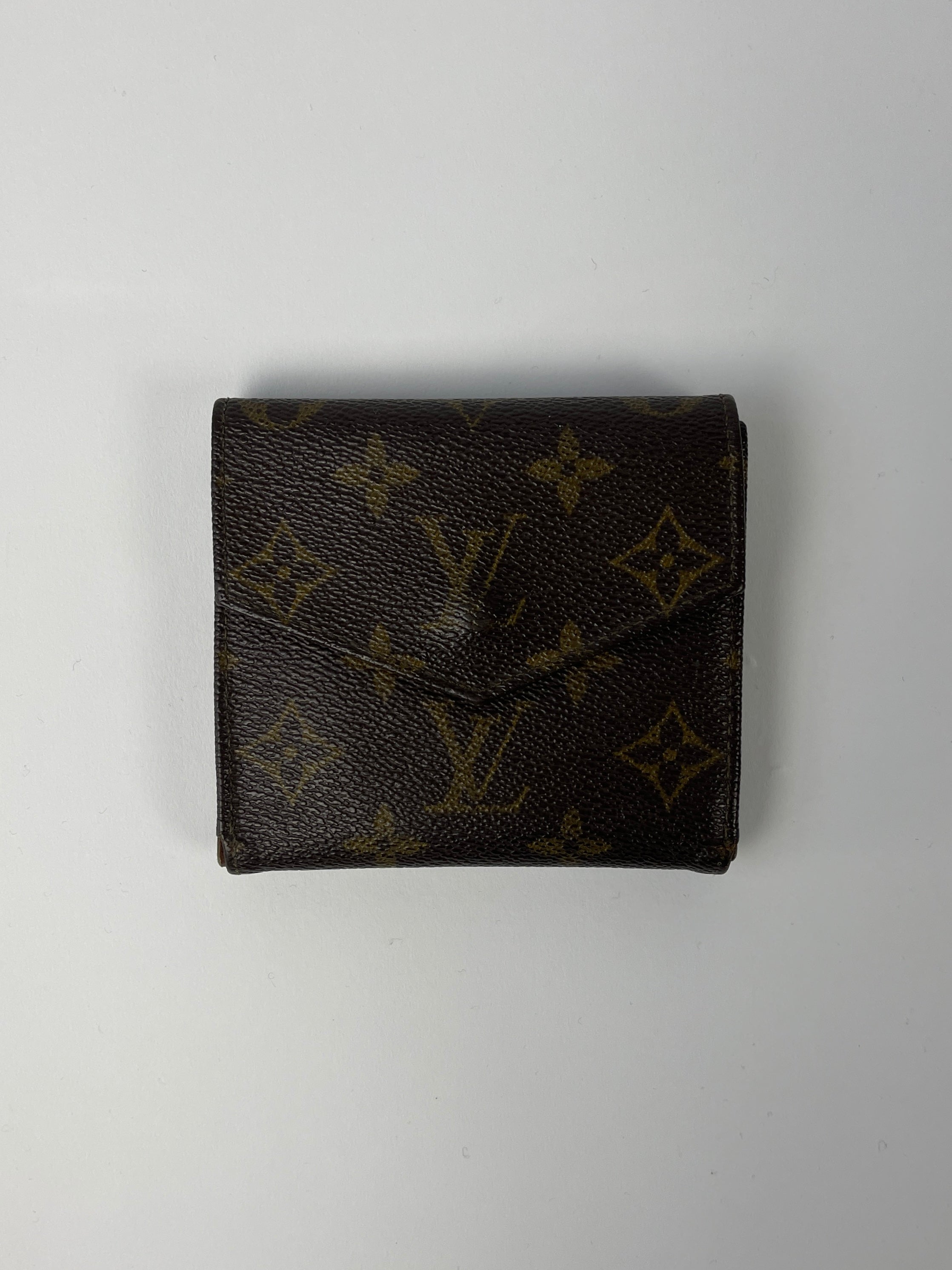 Louis Vuitton 1992 Monogram Wallet in brown leather with signature LV monogram pattern, compact and stylish wallet design
