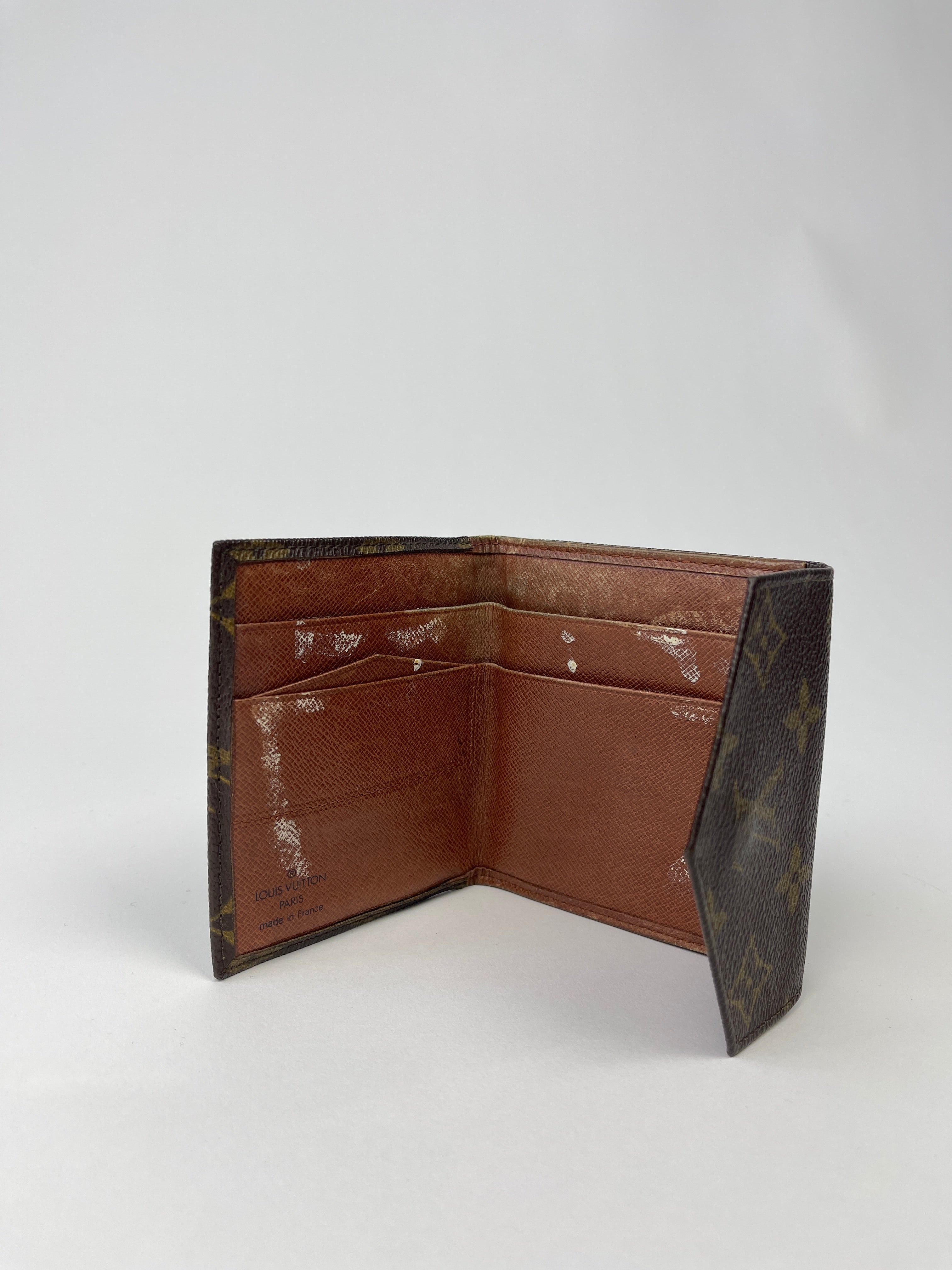 Louis Vuitton 1992 Monogram Wallet showing brown leather interior and classic monogram pattern on the exterior.
