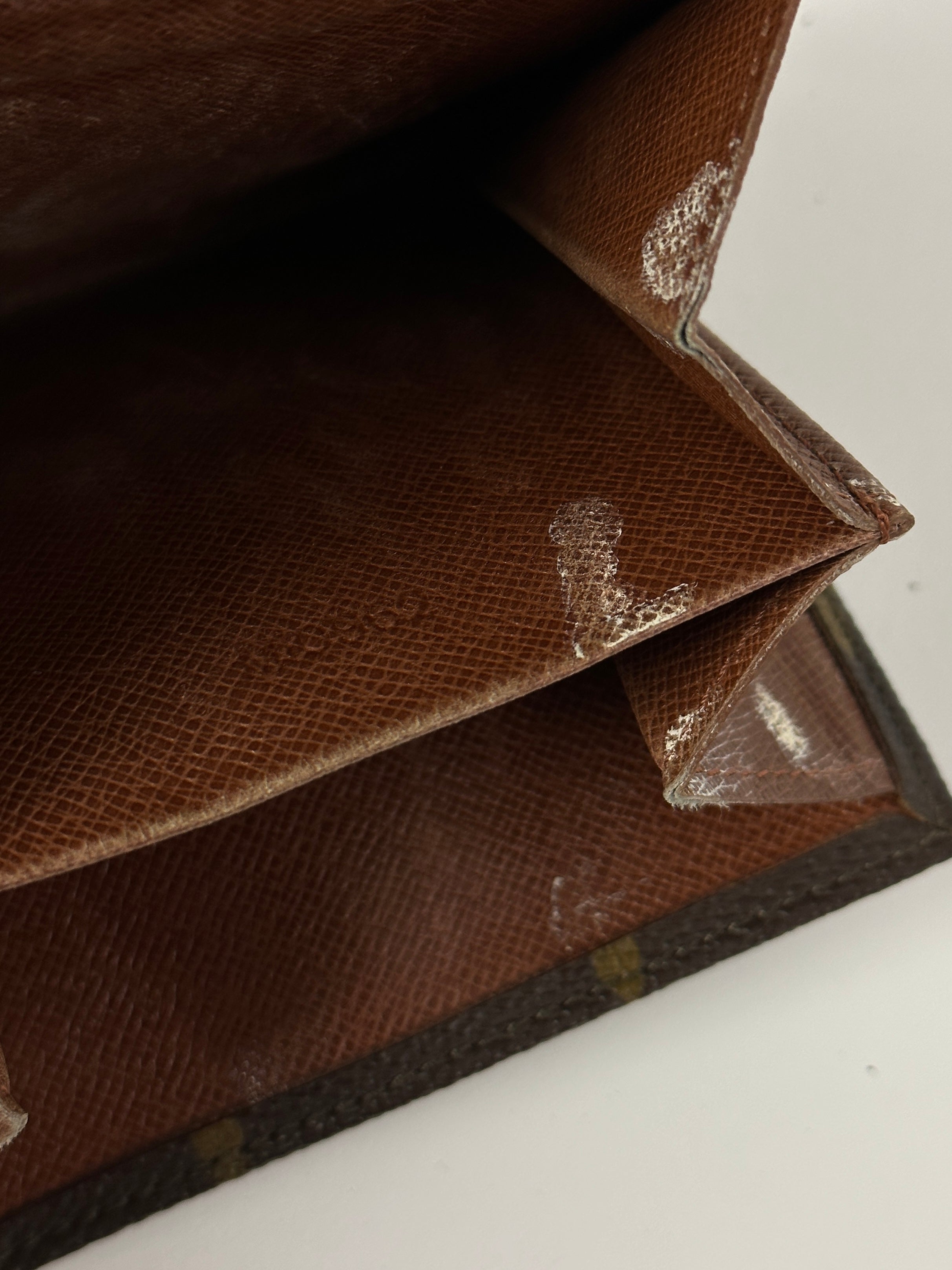 Louis Vuitton 1992 Monogram Wallet featuring brown leather with iconic LV monogram pattern and multiple card slots.
