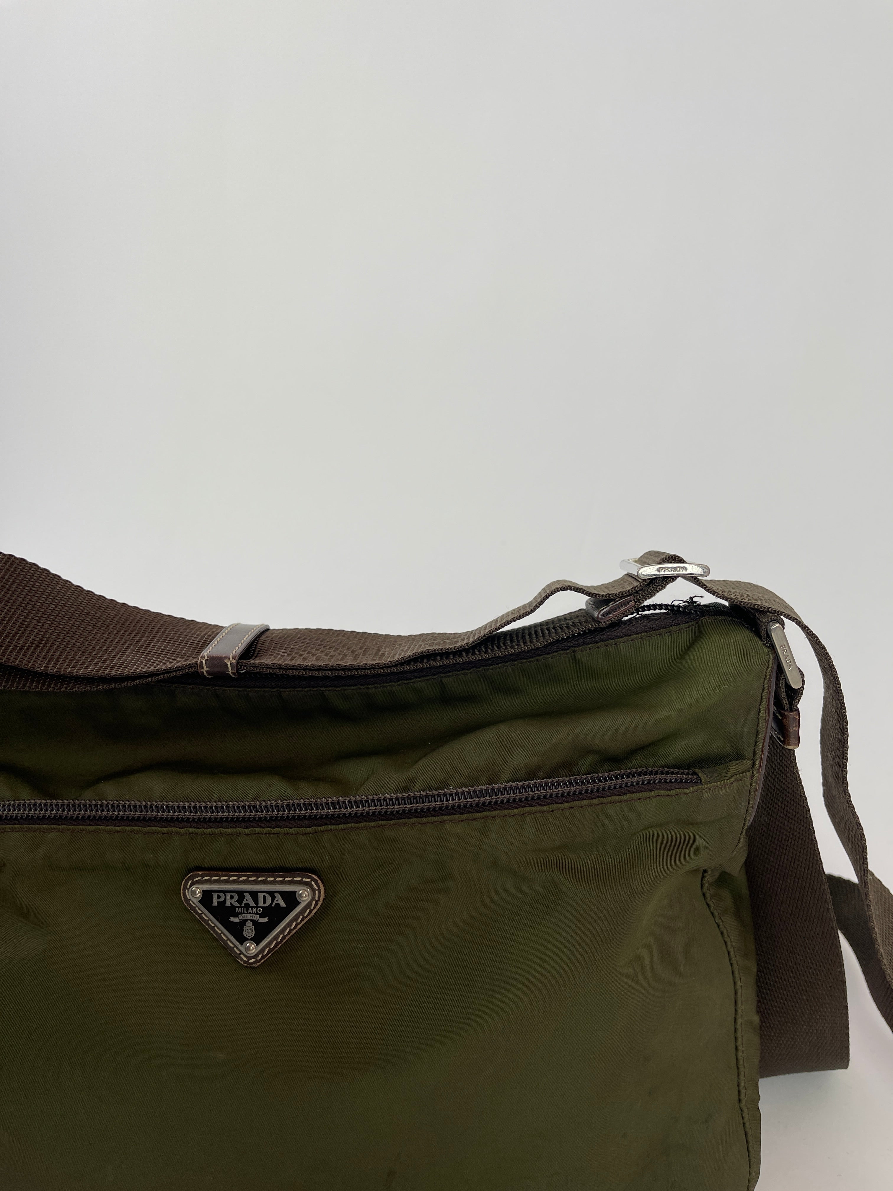 Green Prada nylon crossbody bag with adjustable strap and sleek design, perfect for casual and stylish everyday use.