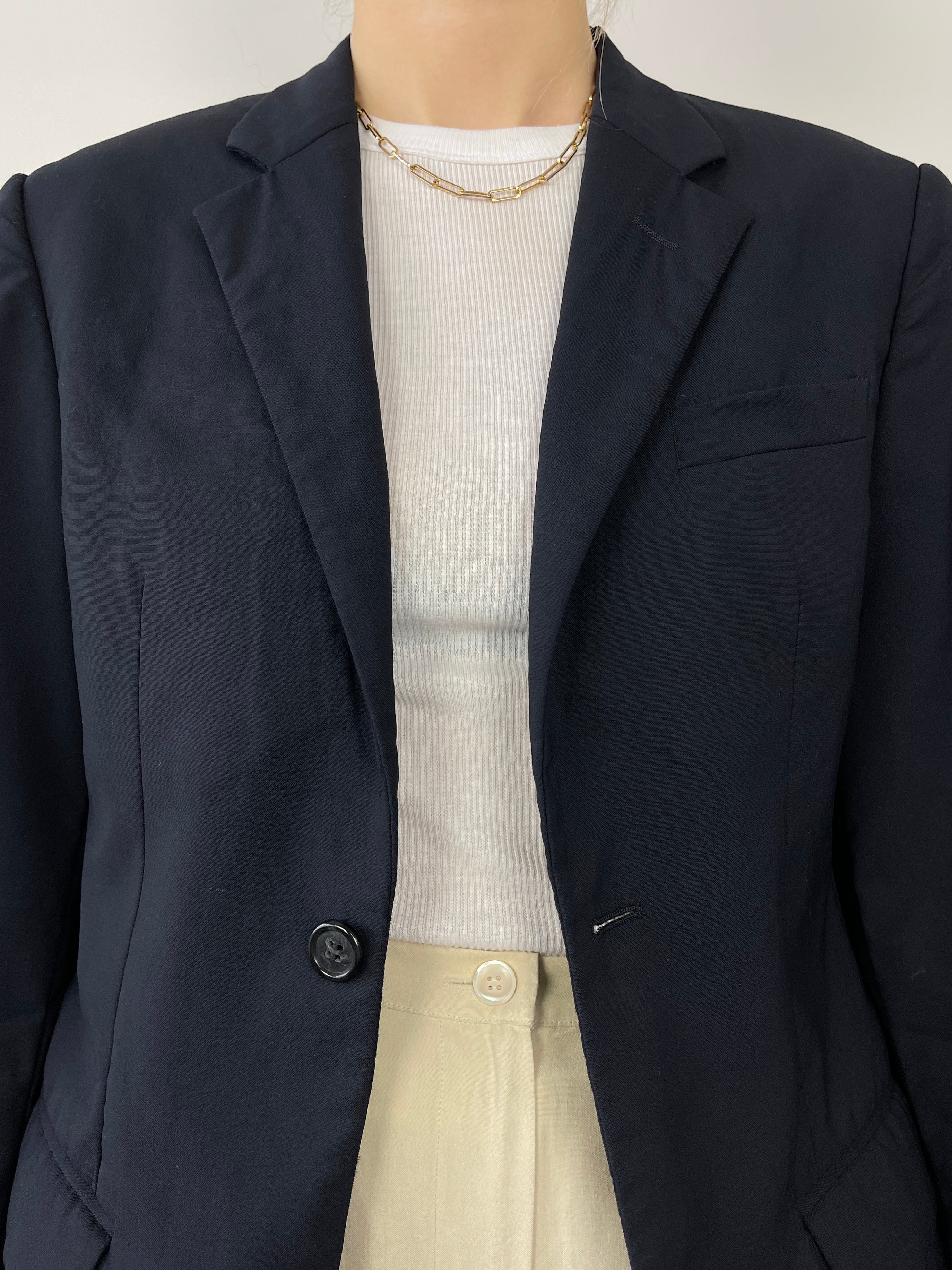 Navy Prada single-breasted tailored blazer with structured fit and classic lapels, displayed on a neutral background.