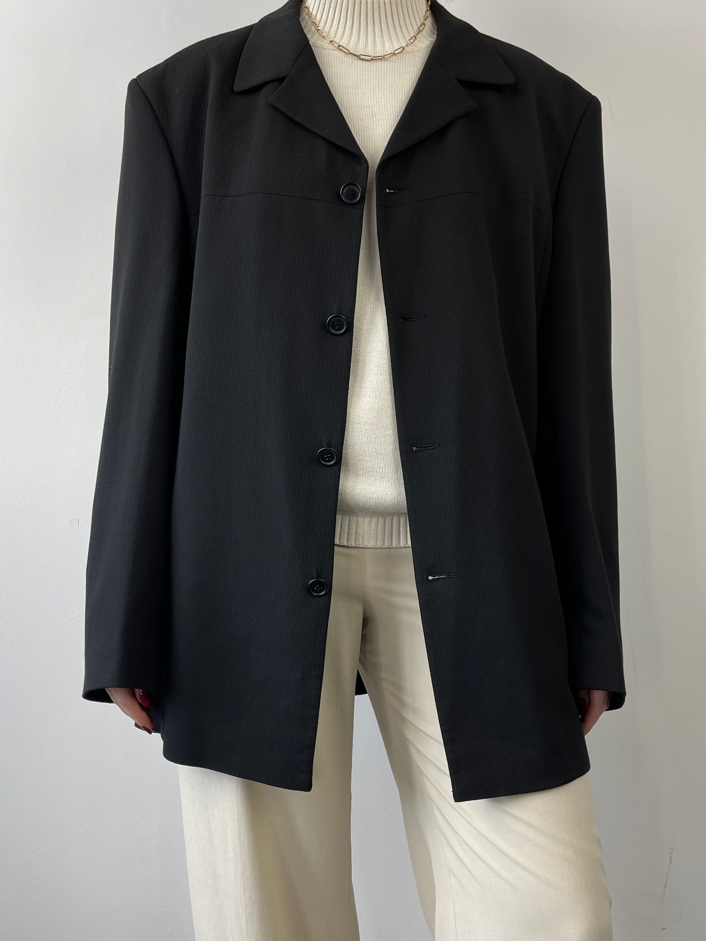 Black Vintage Relaxed Blazer, men's casual tailored blazer with a classic fit and vintage style, displayed on a hanger.