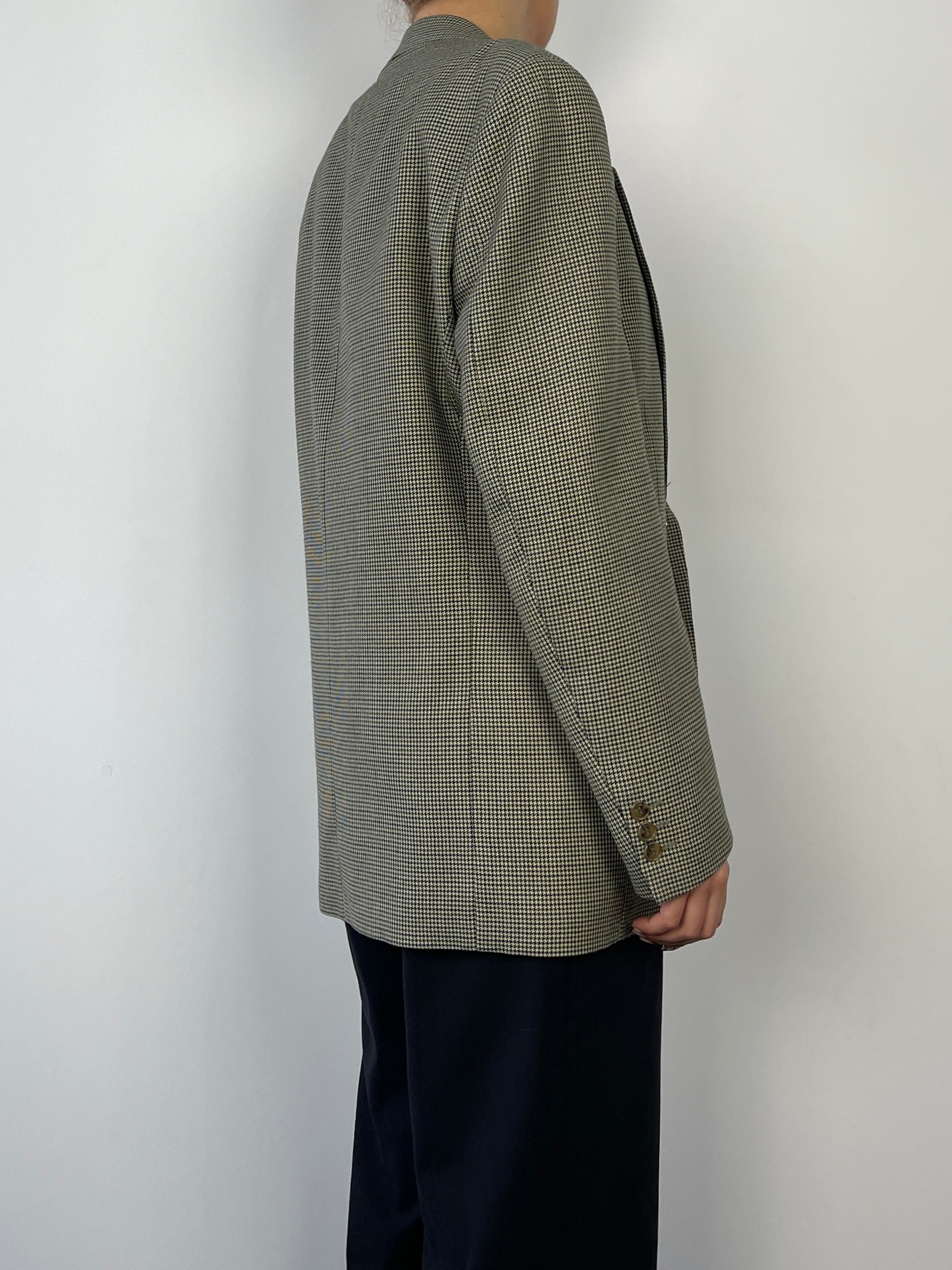 Green vintage wool blazer with a dogtooth pattern, tailored fit, featuring a classic collar and button closure.