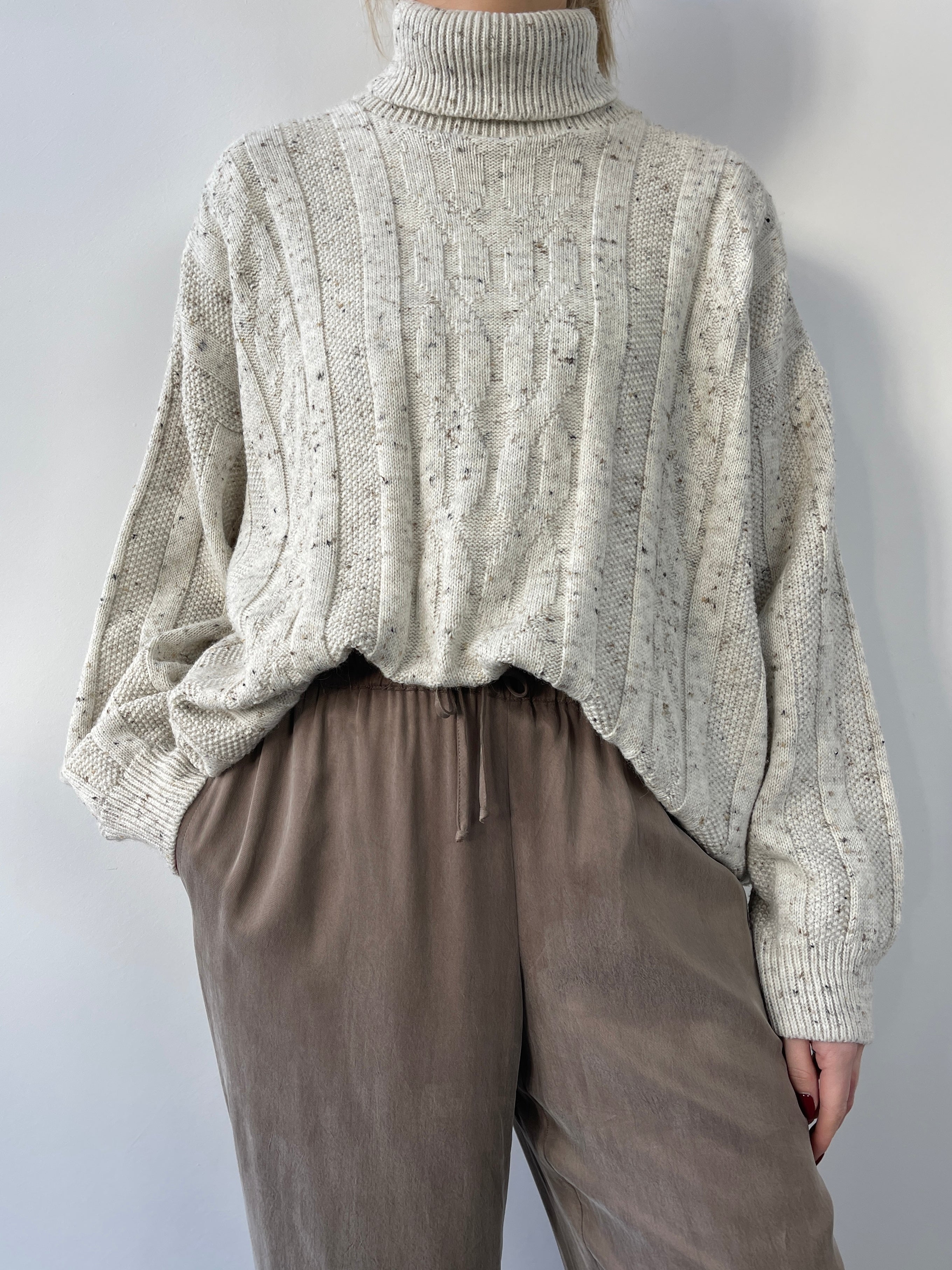 Beige vintage speckle wool roll neck jumper, cozy knit sweater with a classic roll neck, from Vintage brand.