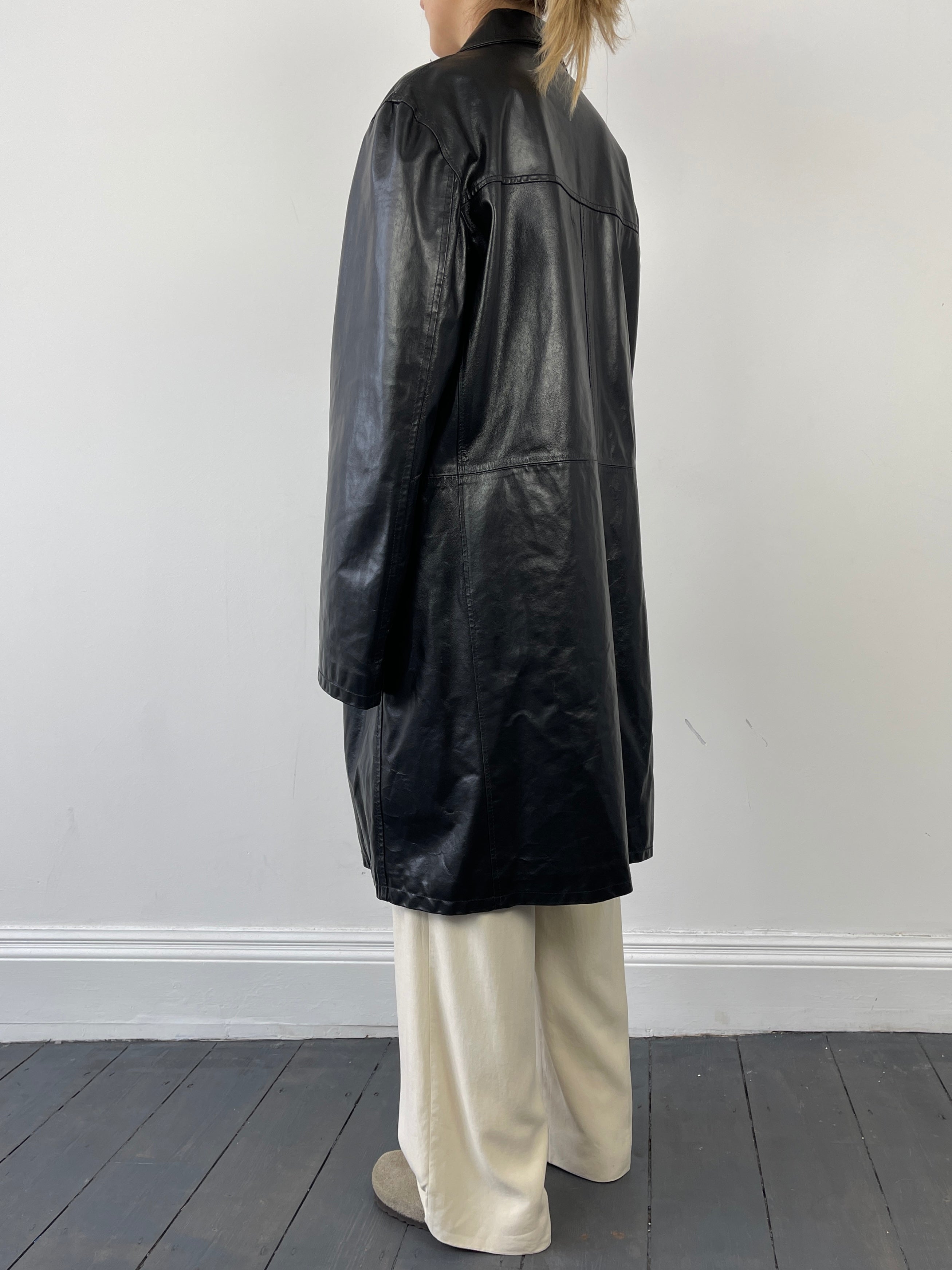 Black Italian vintage leather trench coat jacket with classic design and distressed finish, large size, by Vintage brand.
