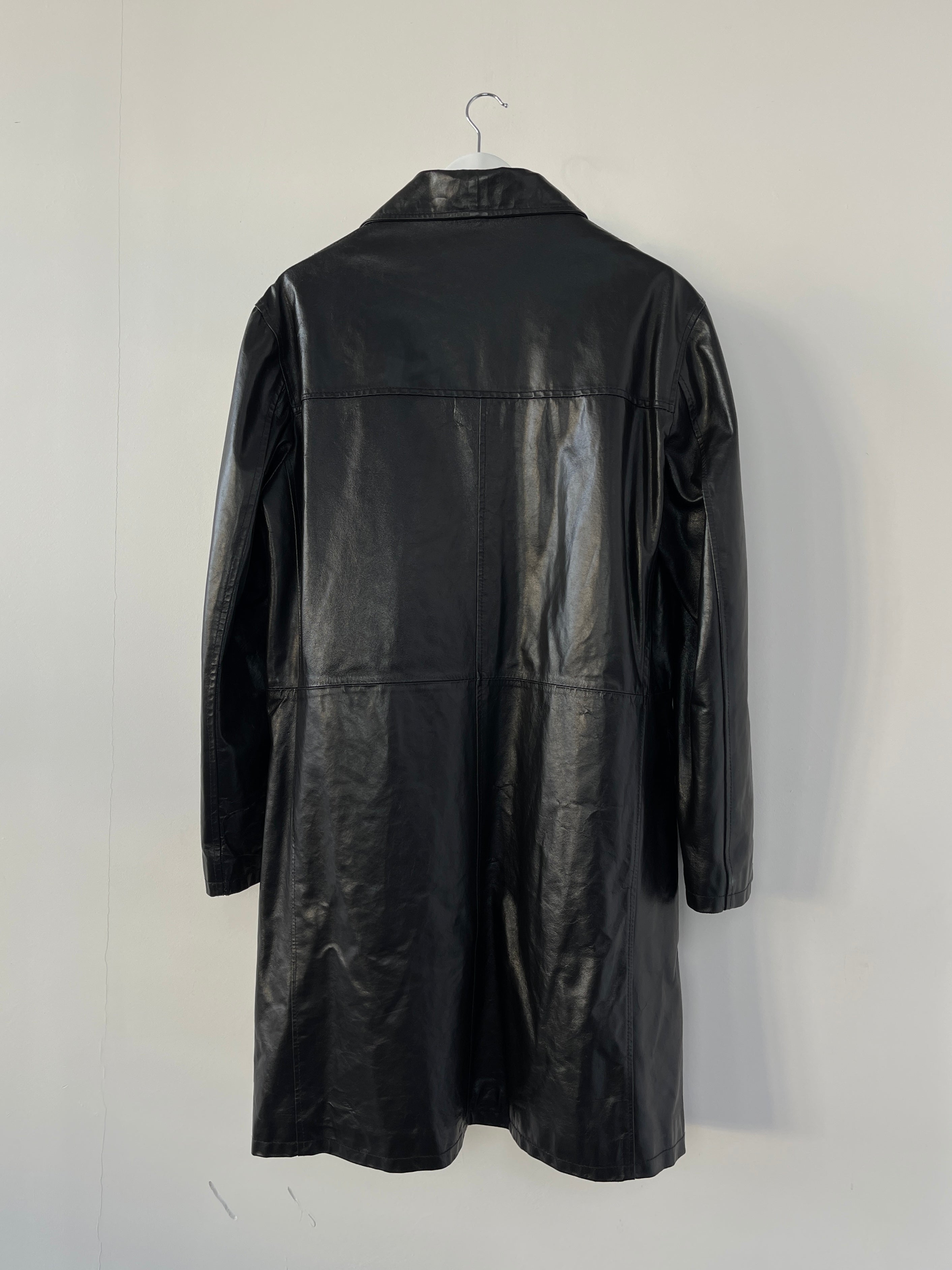 Black Italian vintage leather trench coat jacket, stylish and classic, featuring a tailored fit and authentic leather texture.