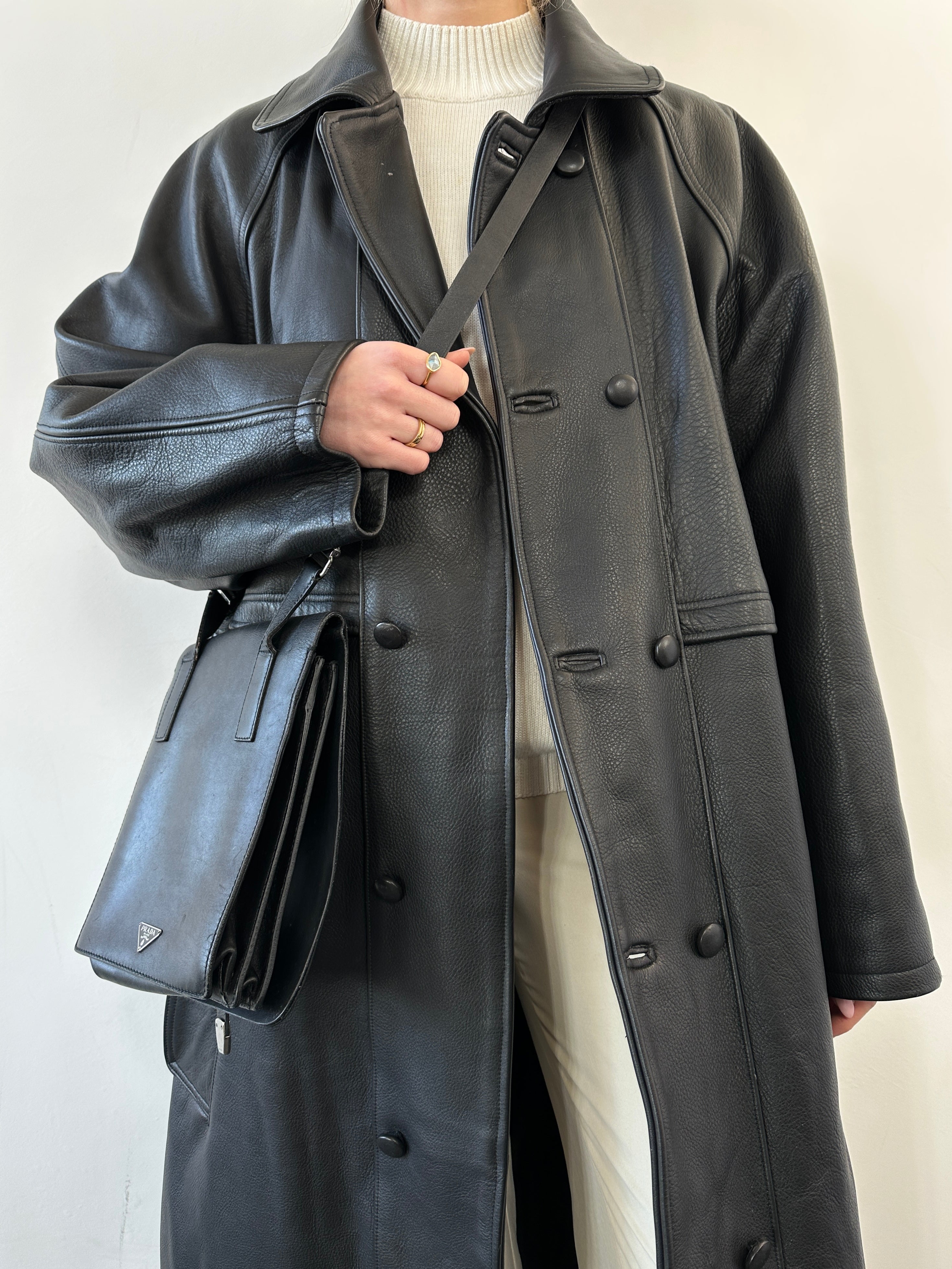 Black vintage leather trench coat jacket with classic design and tailored fit, shown in size XL.