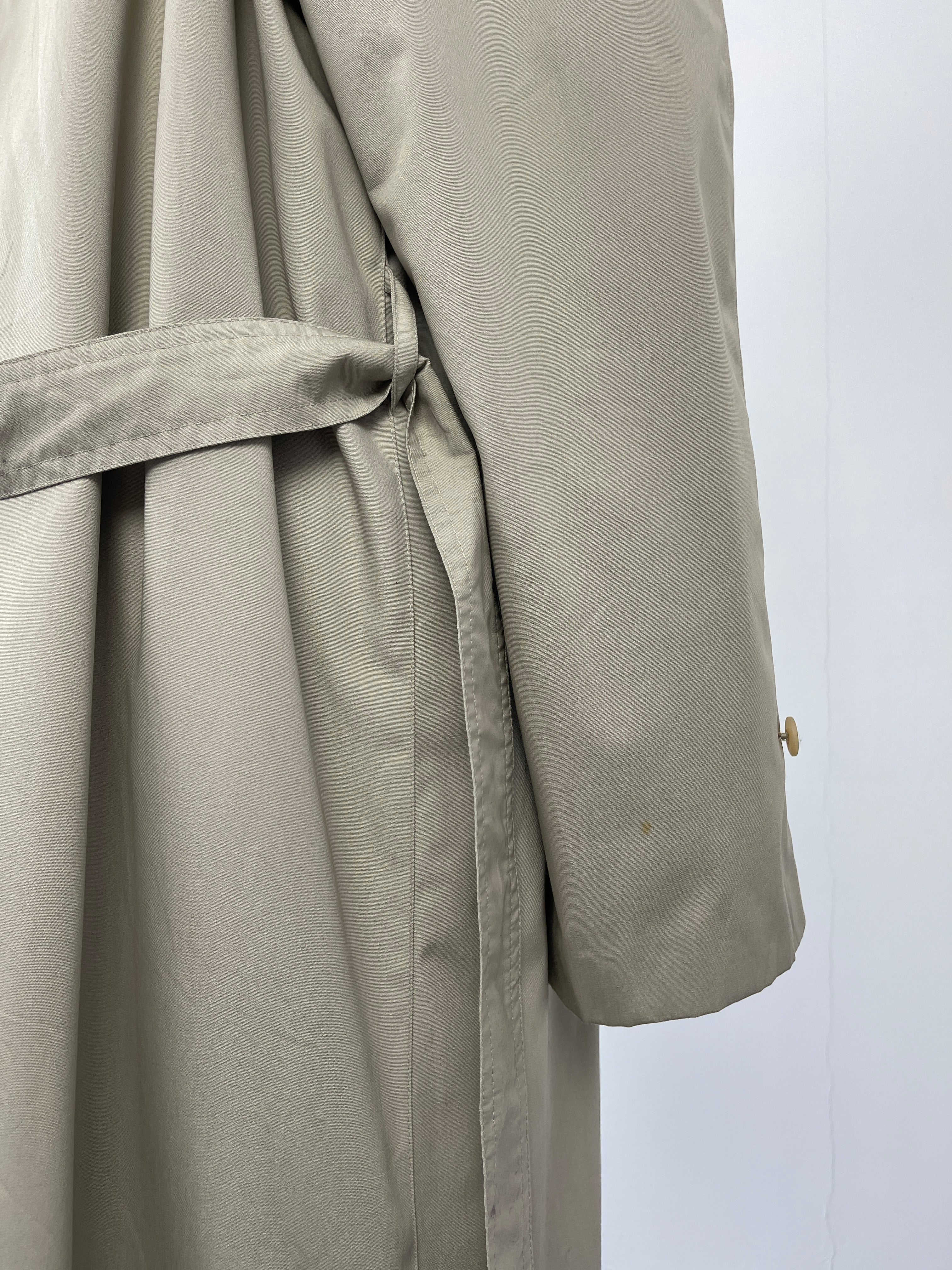 Beige vintage cotton belted trench coat with classic design and large fit, displayed on a hanger.