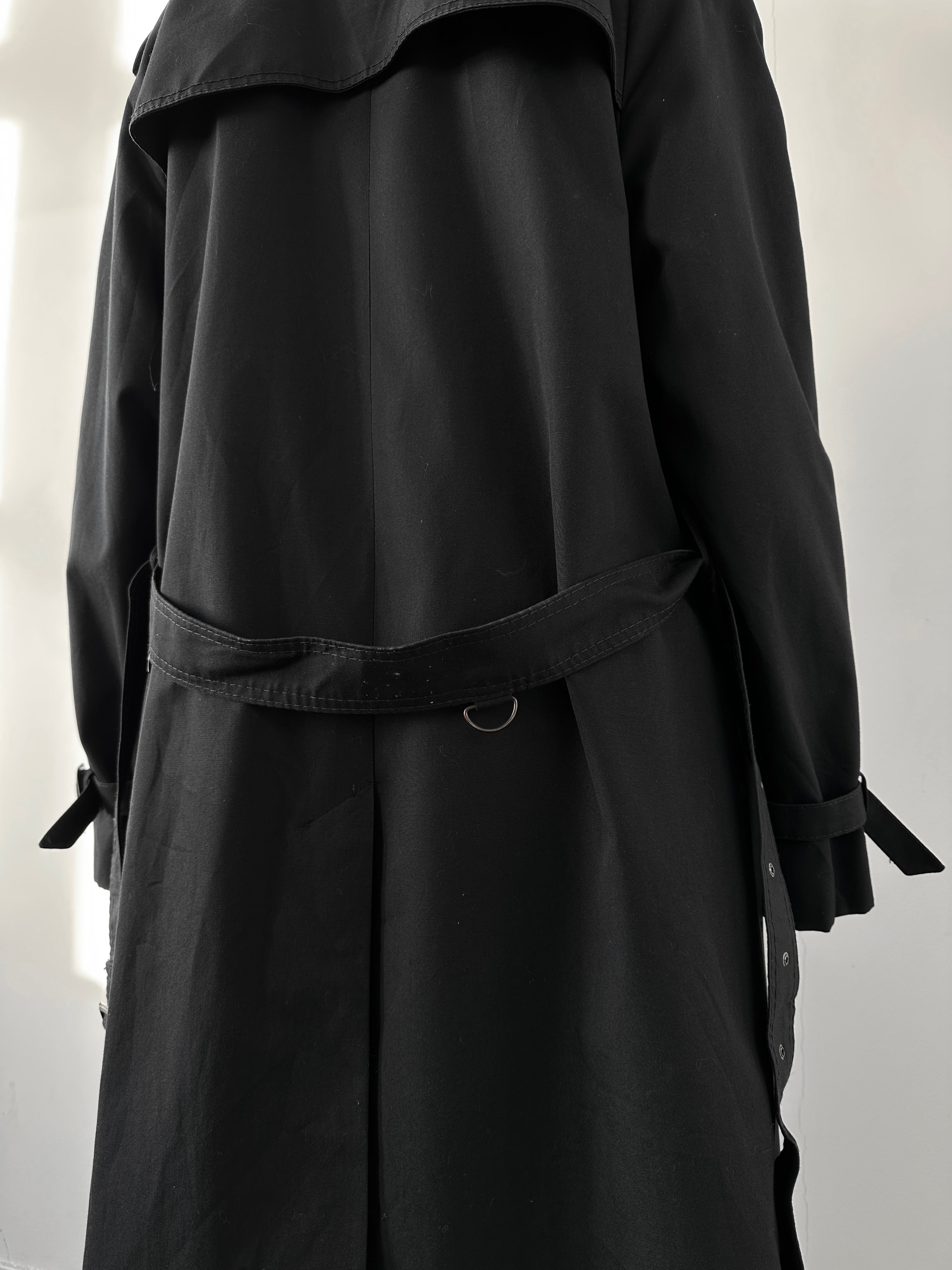 Black vintage cotton trench coat with a belt, featuring classic design and tailored fit, perfect for timeless outerwear style.